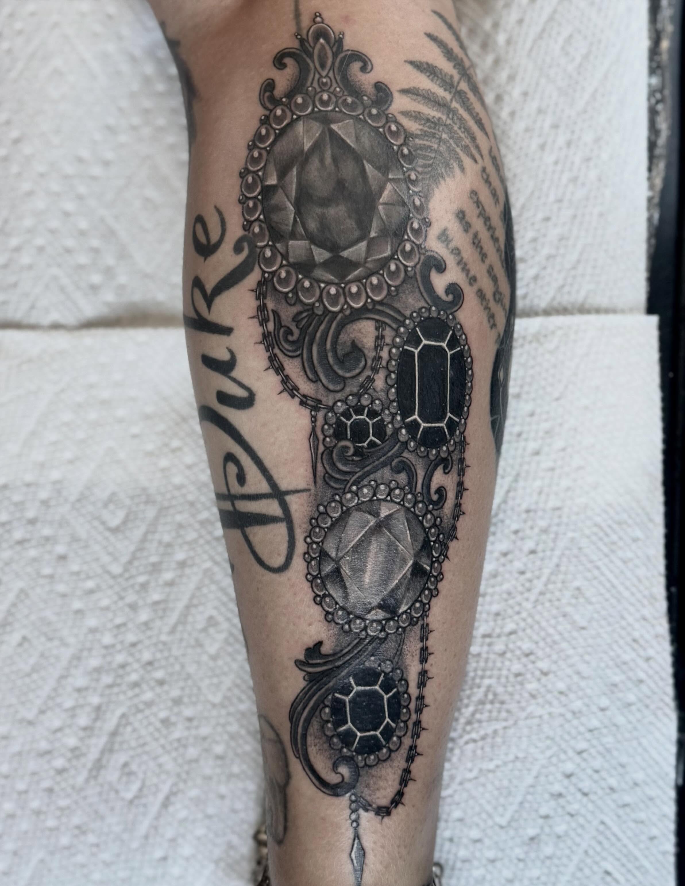 Jeweled ornament geometric tattoo on the forearm by @carissaetattoos