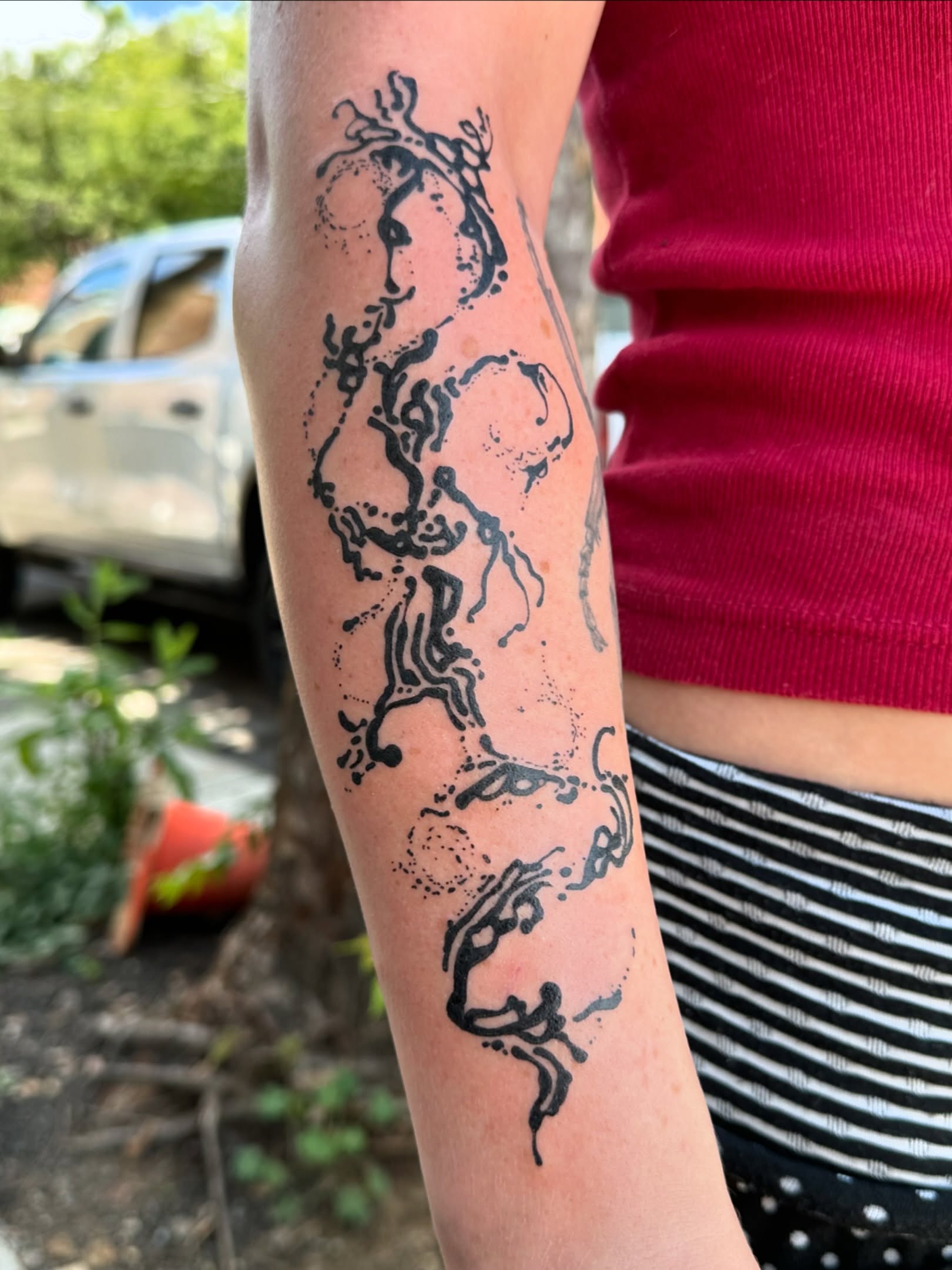 Abstract design dotwork tattoo on the forearm by reid - tattoo artist