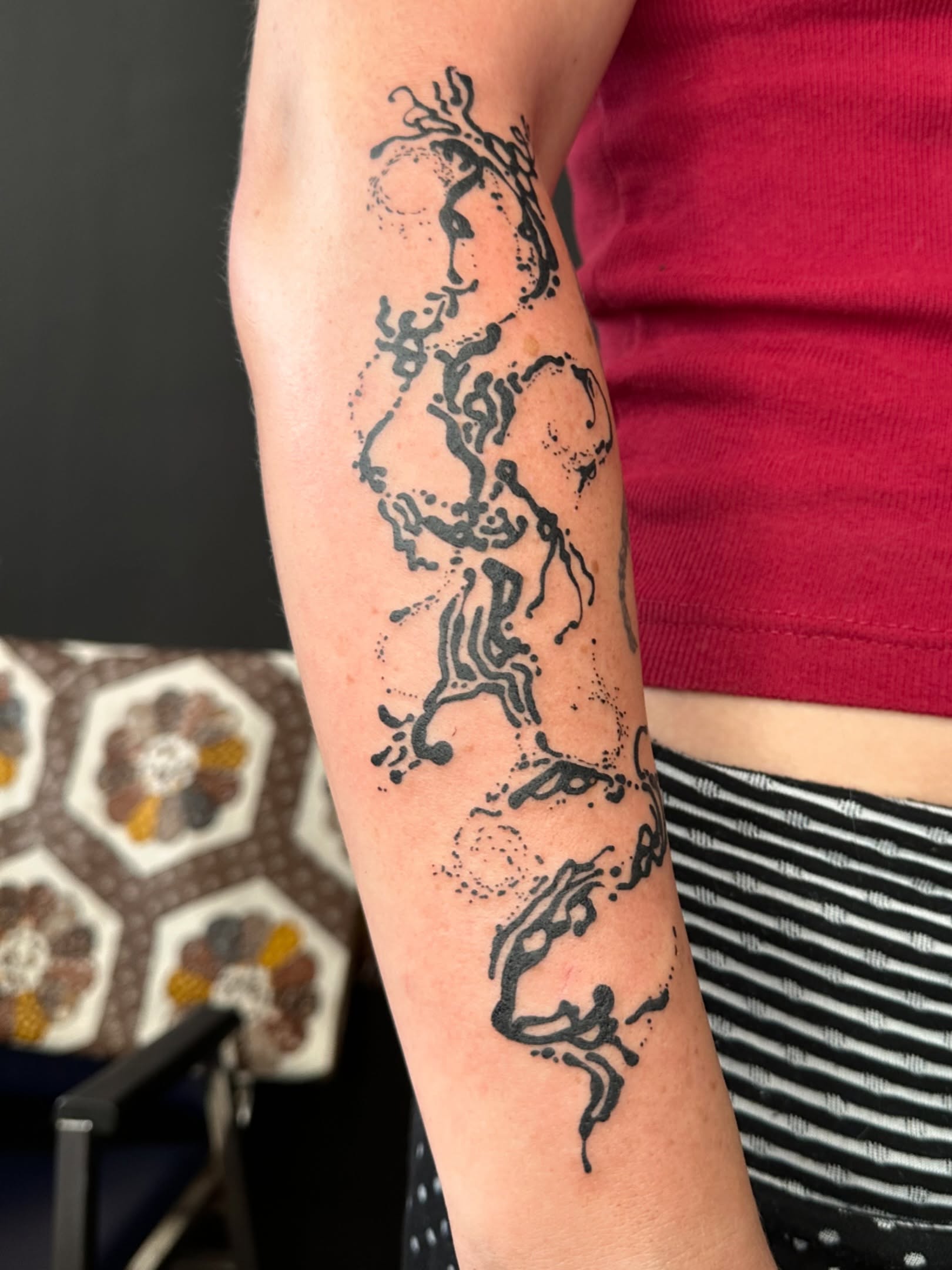 Abstract design dotwork tattoo on the forearm by reid - tattoo artist