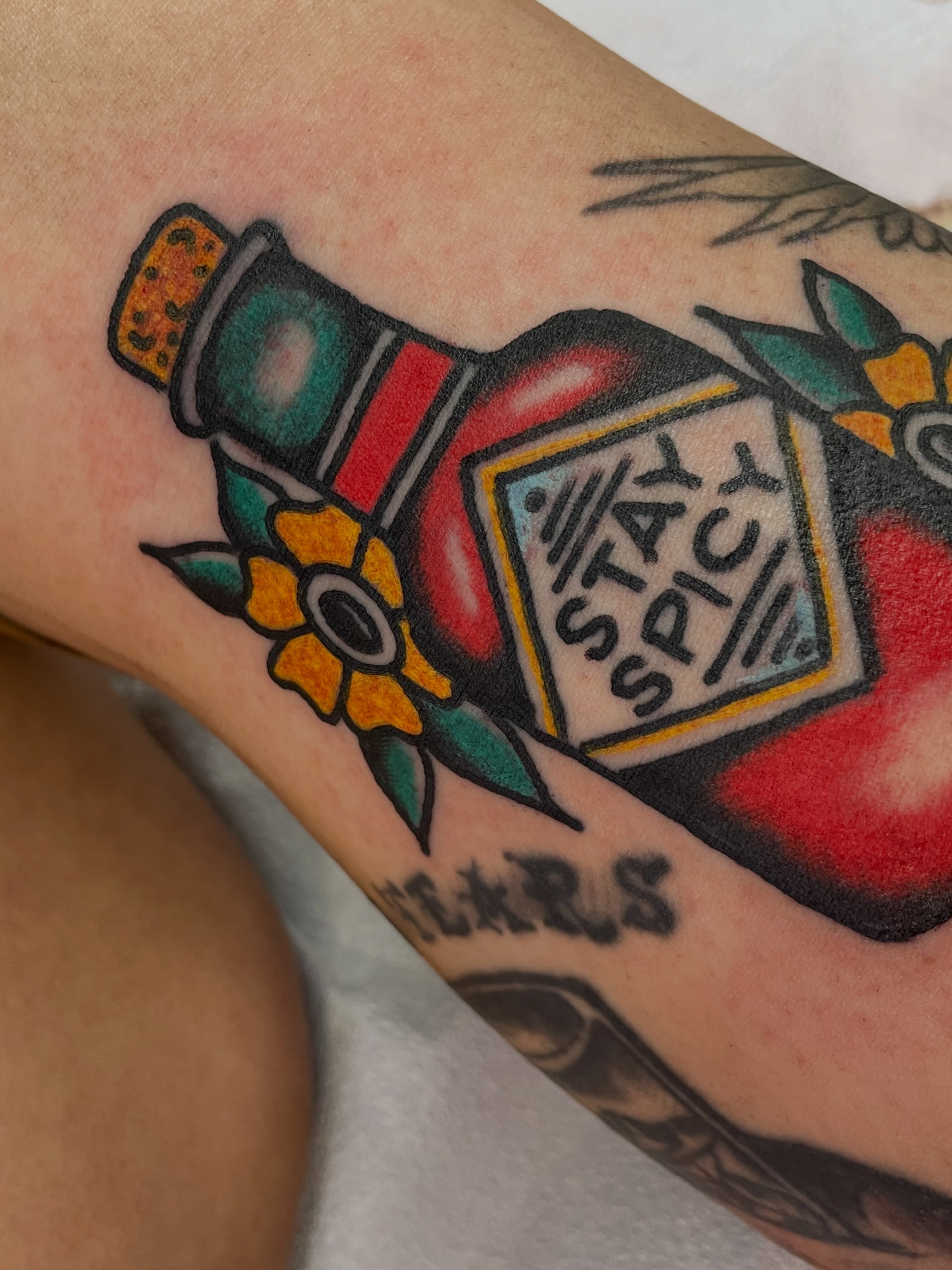 Hot sauce bottle American traditional tattoo on the forearm by dave rash