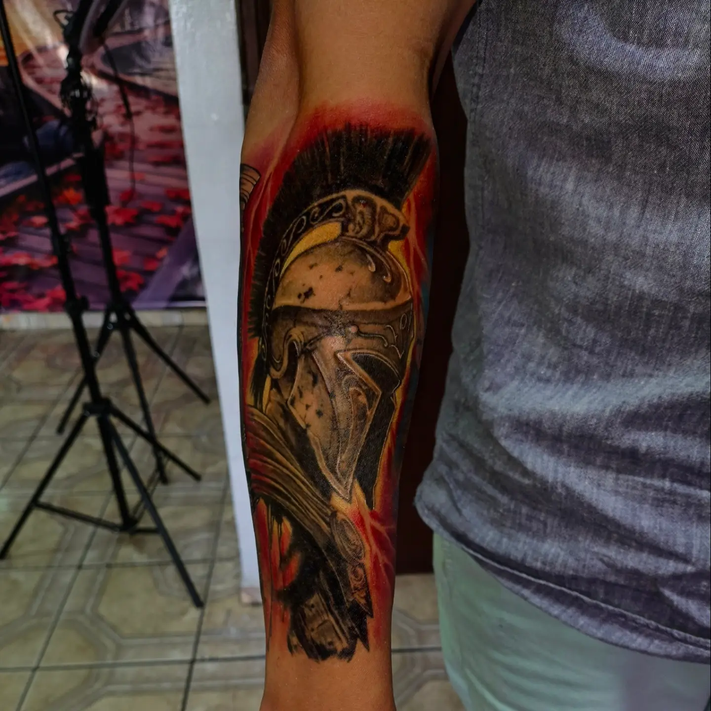 Spartan helmet realism tattoo on the forearm by Alexander Tattooink