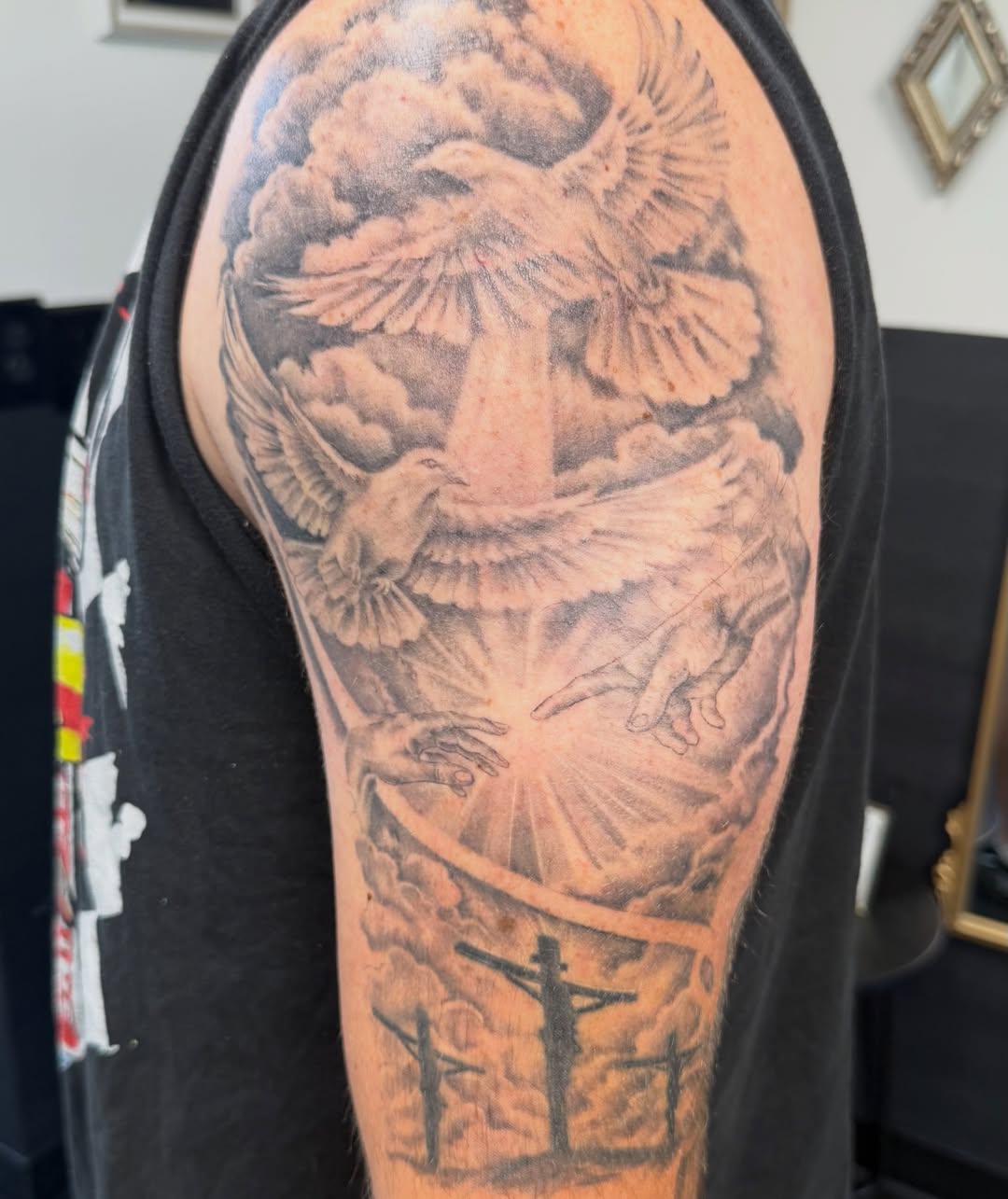 Religious iconography black and grey tattoo on the forearm by Daniel Smith