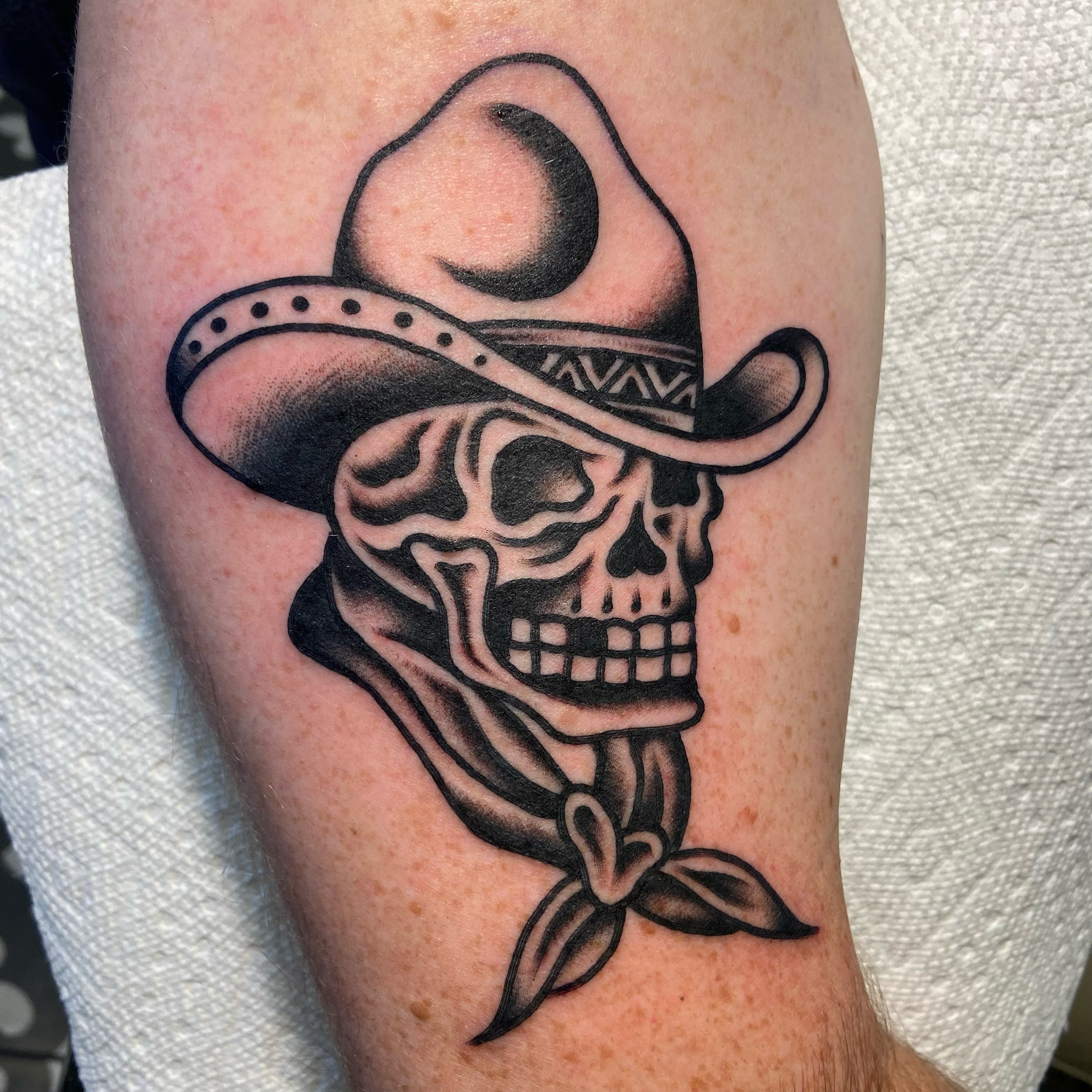 Cowboy skull American traditional tattoo on the forearm by Anthony Jaeger, Seattle, Washington