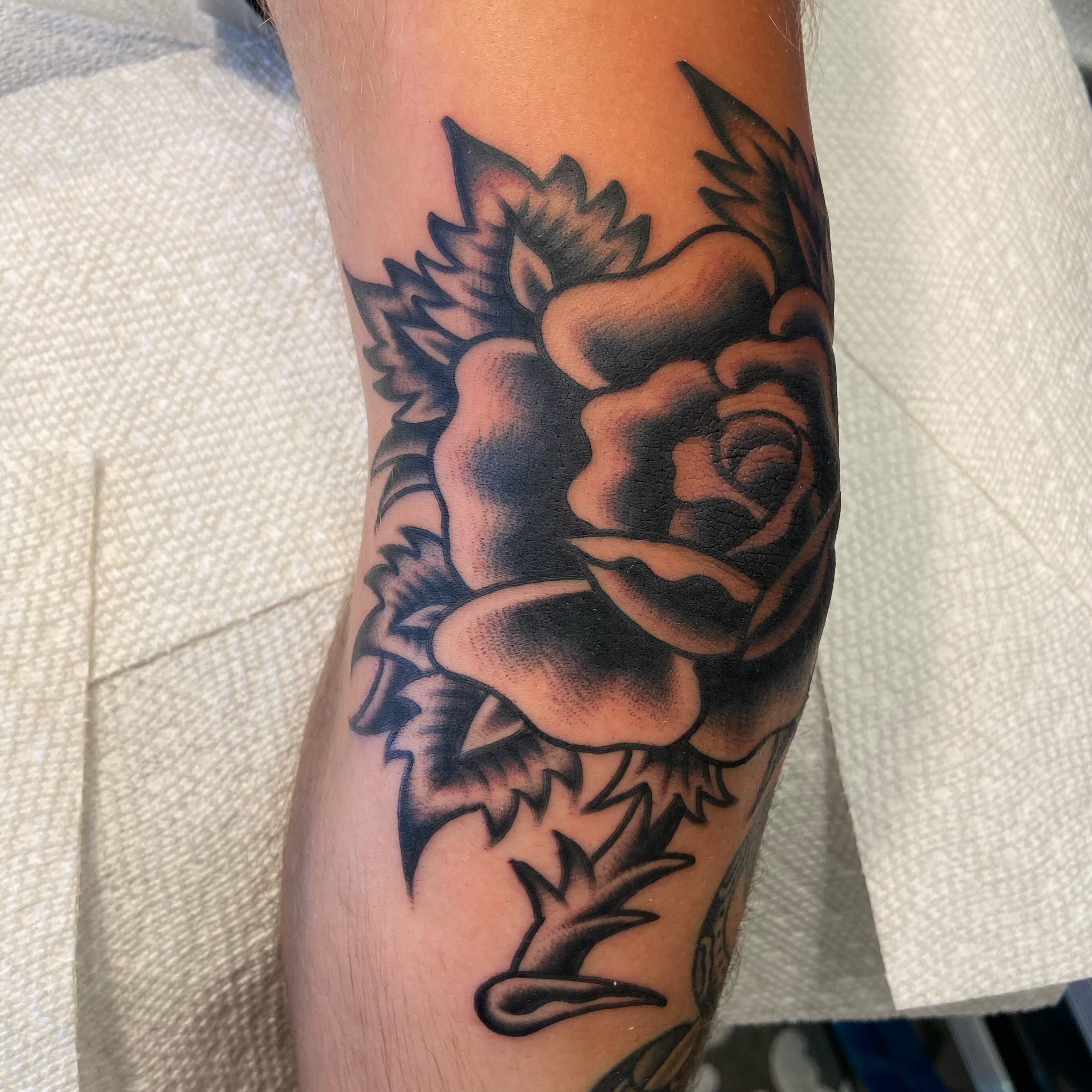 Rose American traditional tattoo on the forearm by Anthony Jaeger, Seattle, Washington