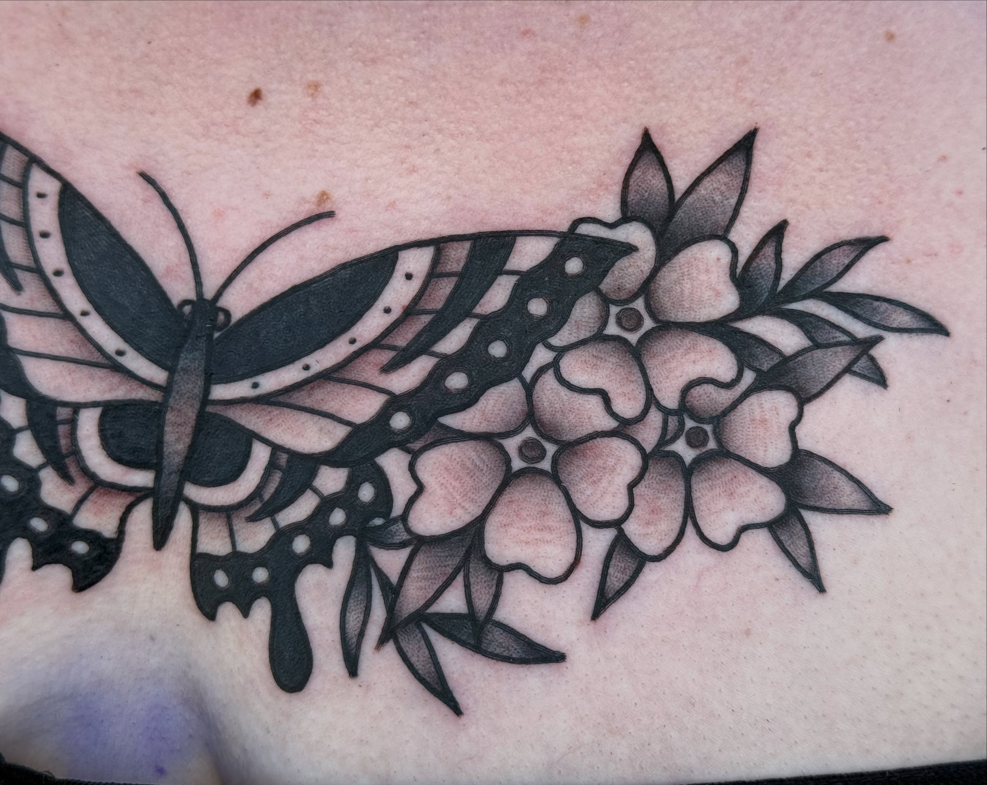 Butterfly and flowers black and grey tattoo by Kelsey Louis, Iowa City, Iowa