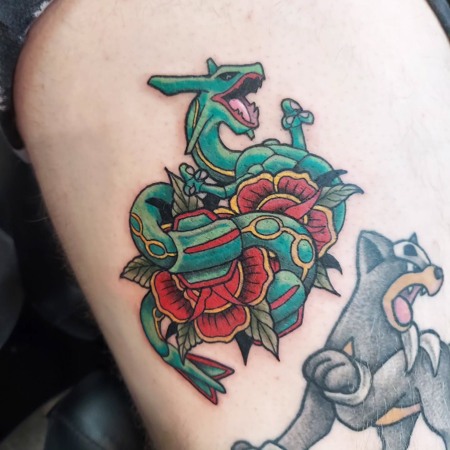 Snake and peony American traditional tattoo on the shoulder by Kari Rhoades, Marion, Iowa