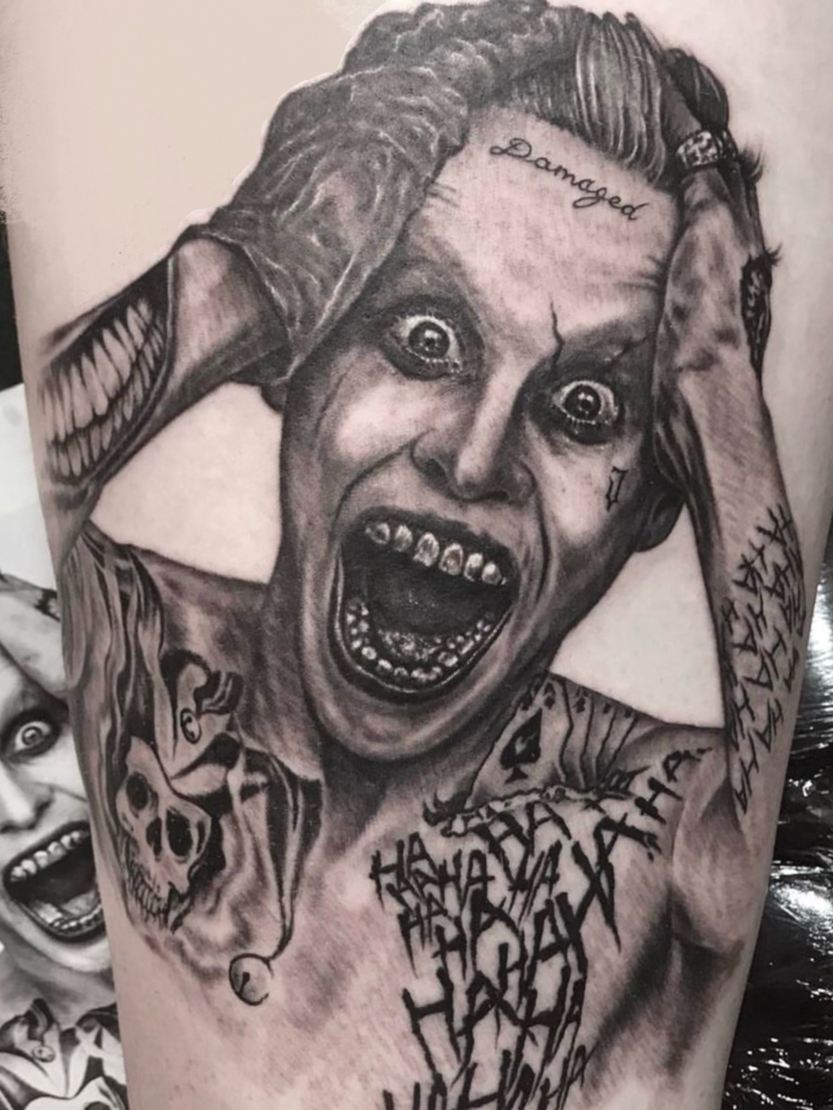 Joker realism tattoo on the upper arm by @luckybunnytat2