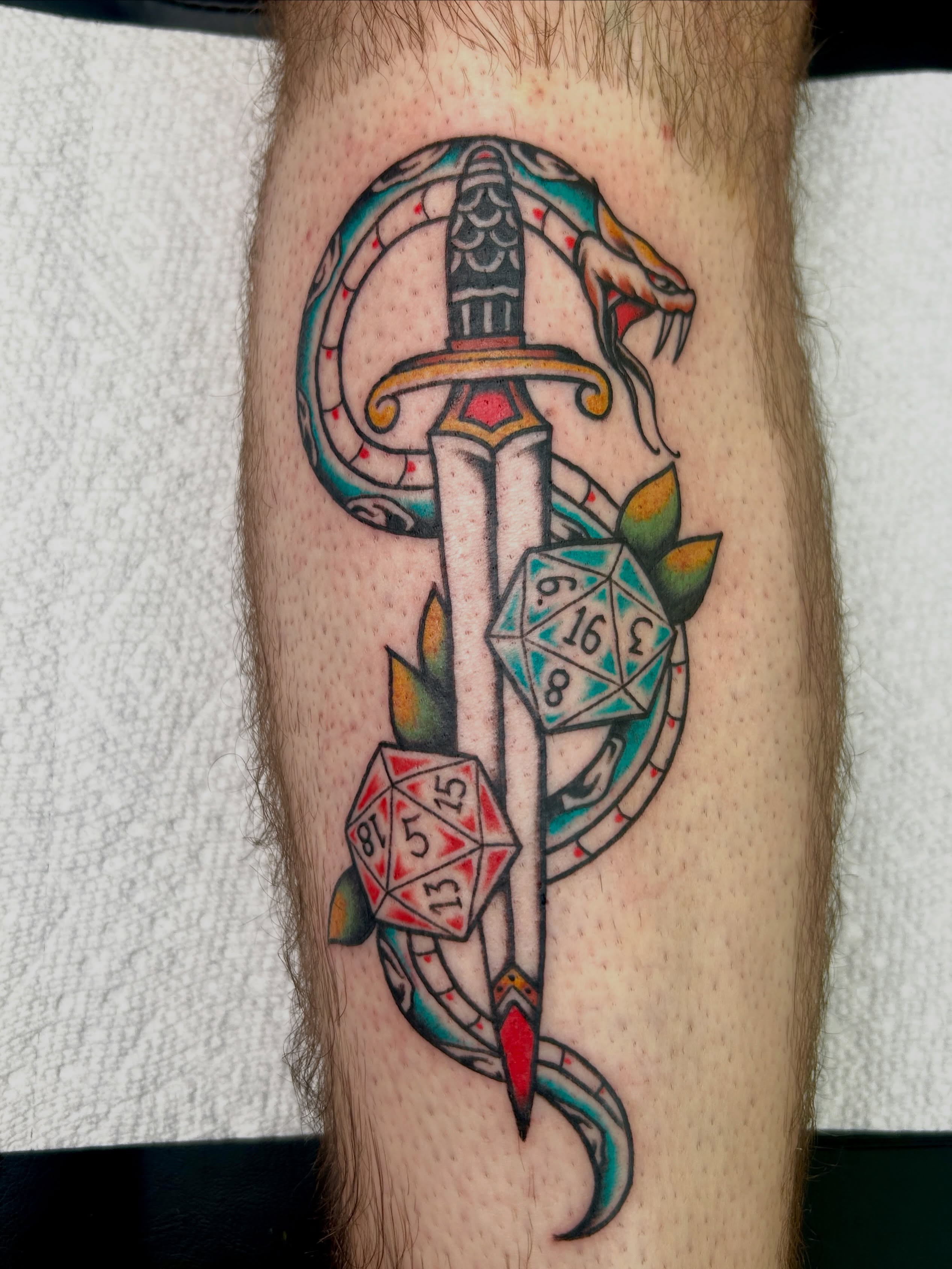 Sword and snake American traditional tattoo on the forearm by Dylan James