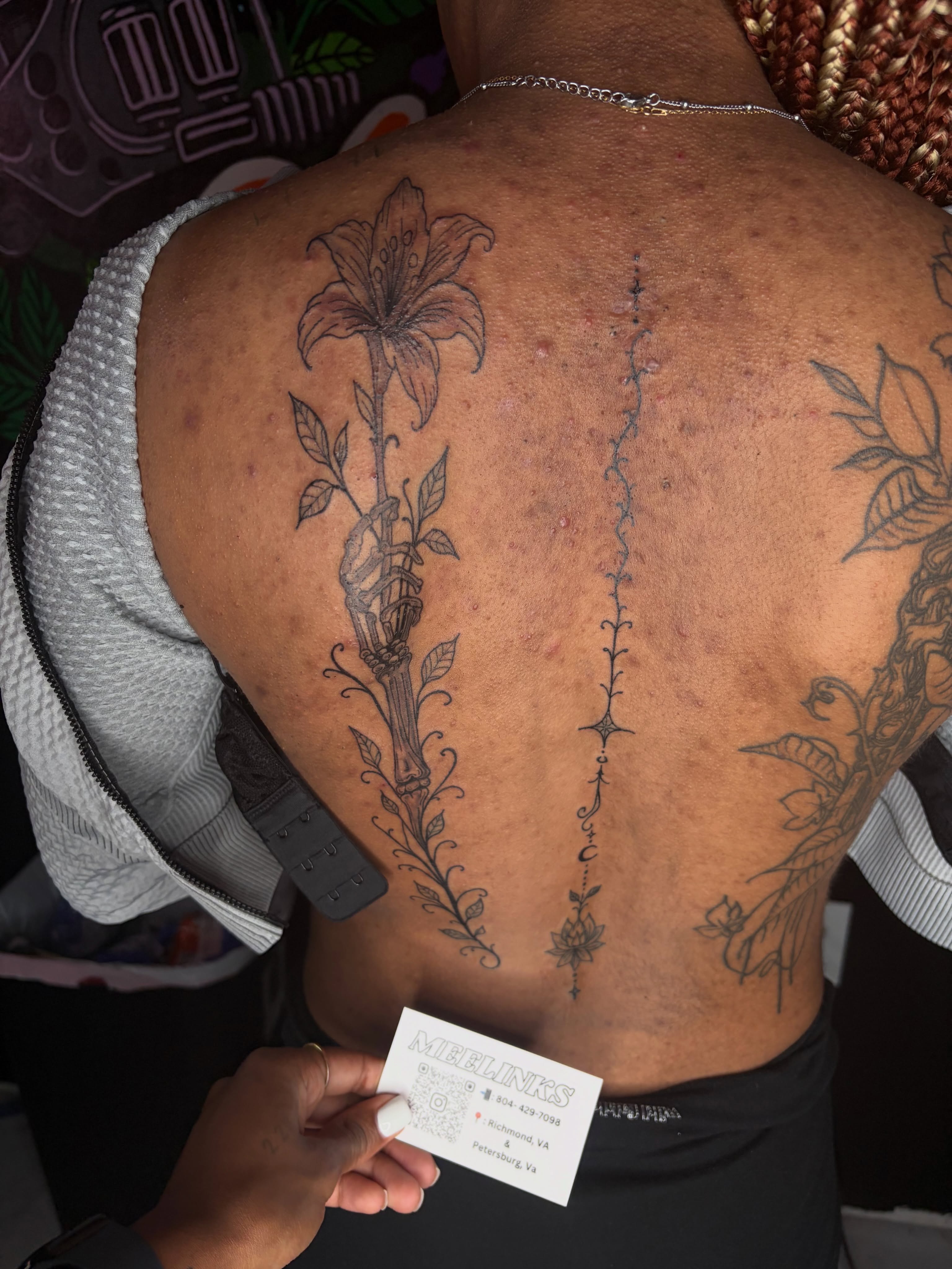 Lily black and grey tattoo on the back by Meela Inks ๐, Richmond, Virginia