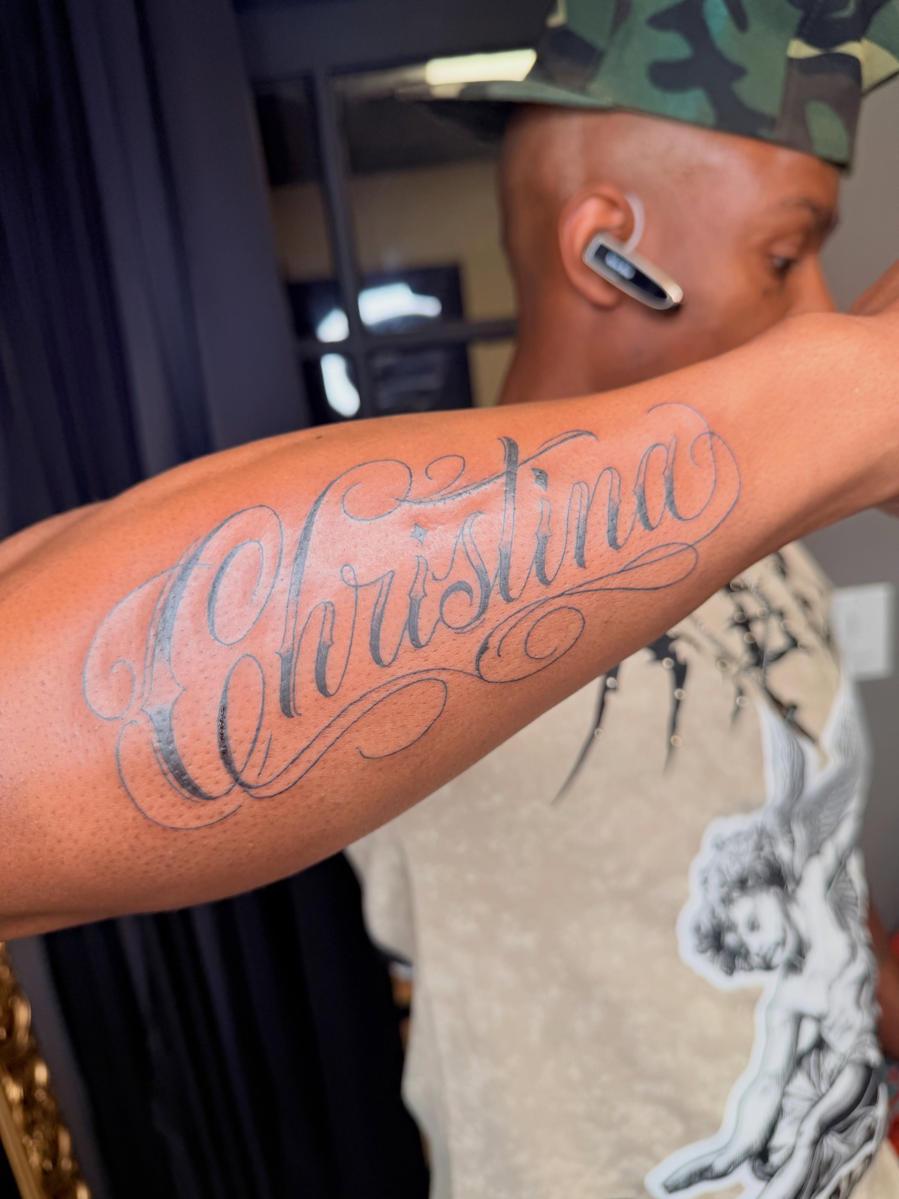 Christina lettering script tattoo on the forearm by Rain David