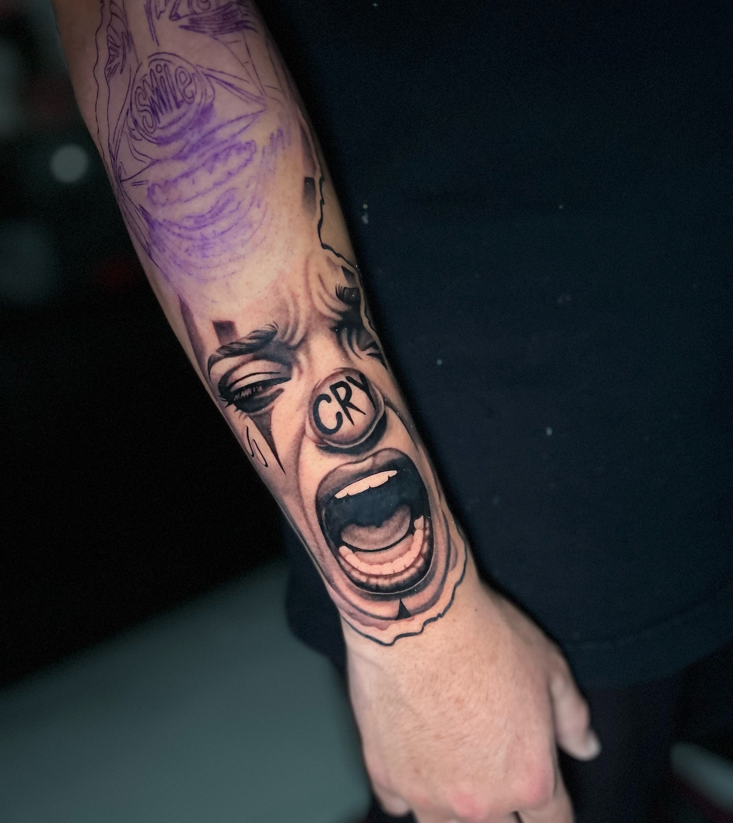 Crying face realism tattoo on the forearm by Crooks Ink ✞