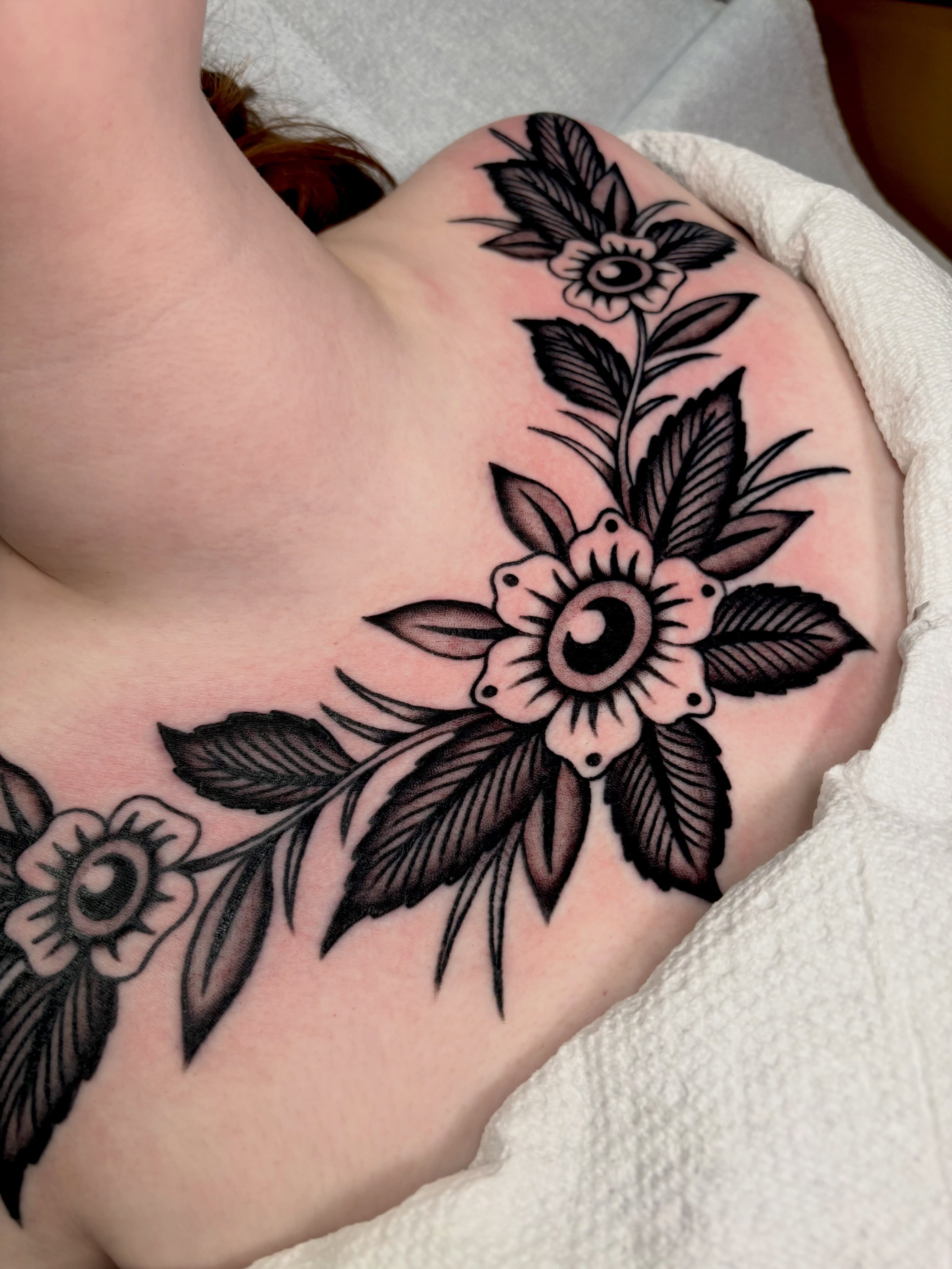 Floral arrangement black and grey tattoo on the shoulder by sally ★ lee
