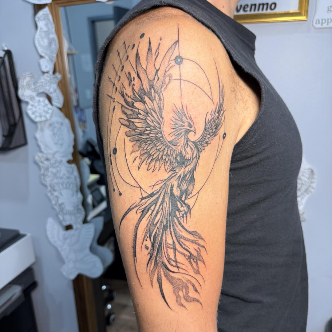 Phoenix black and grey tattoo on the shoulder by Destiny A