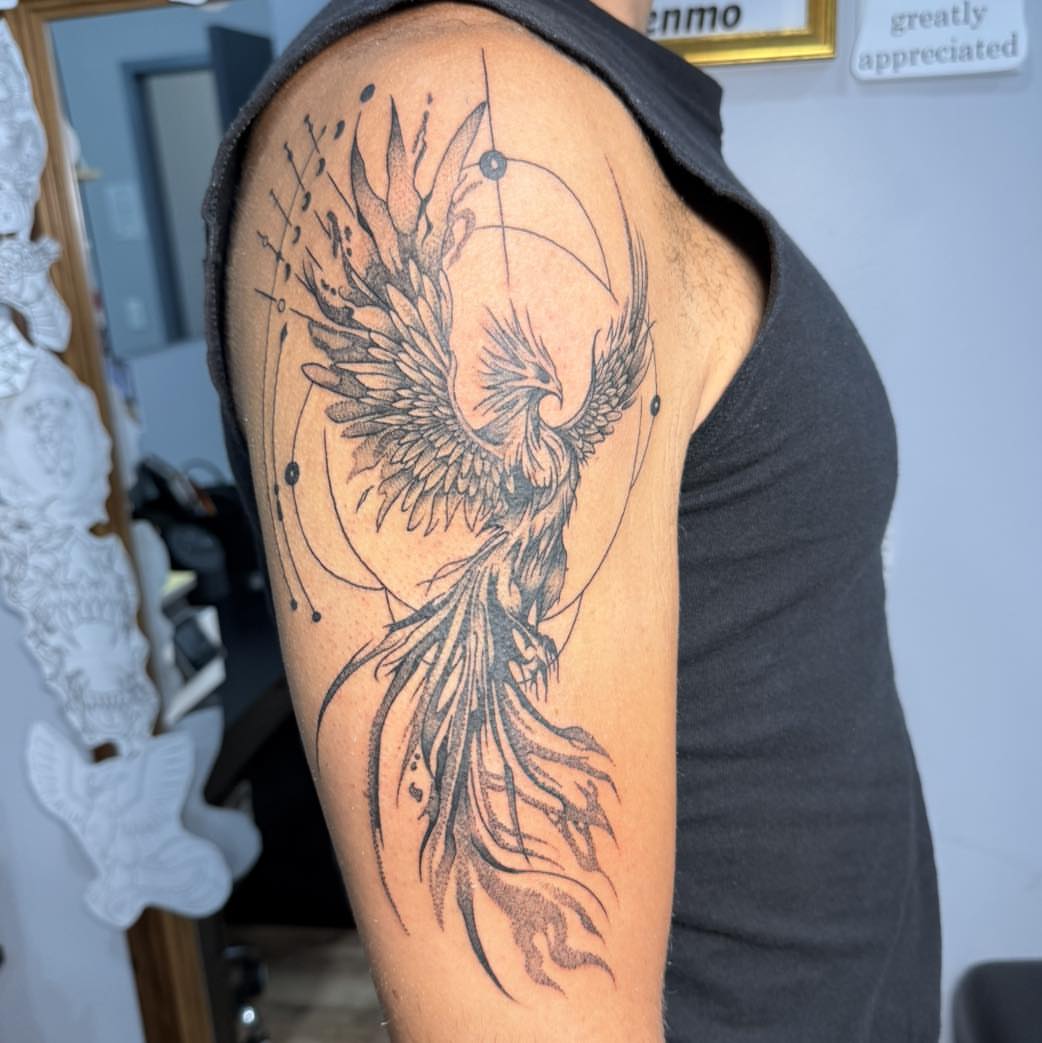 Phoenix black and grey tattoo on the shoulder by Destiny A