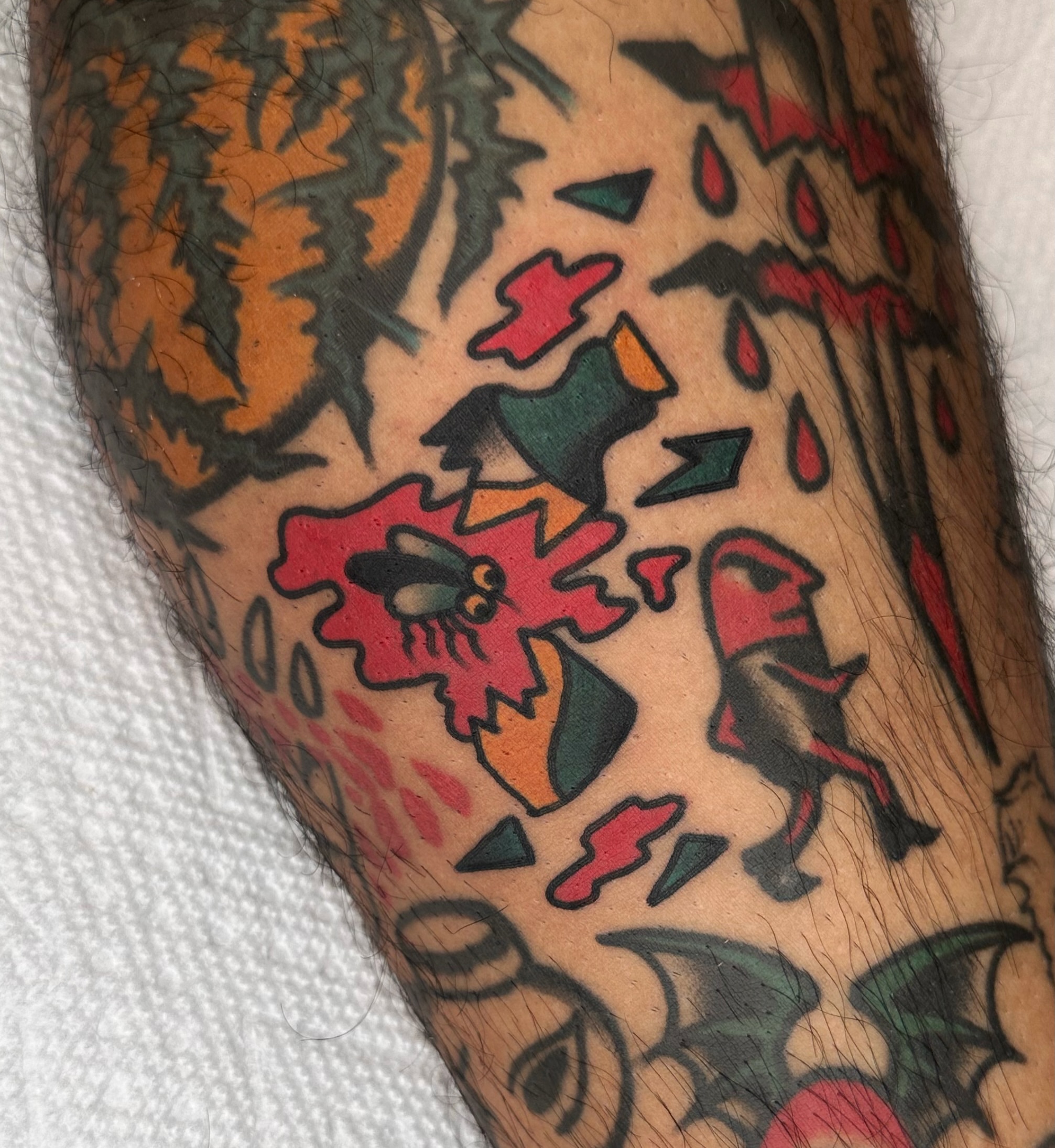 Fly and ghost American traditional tattoo on the forearm by Brock Johnson