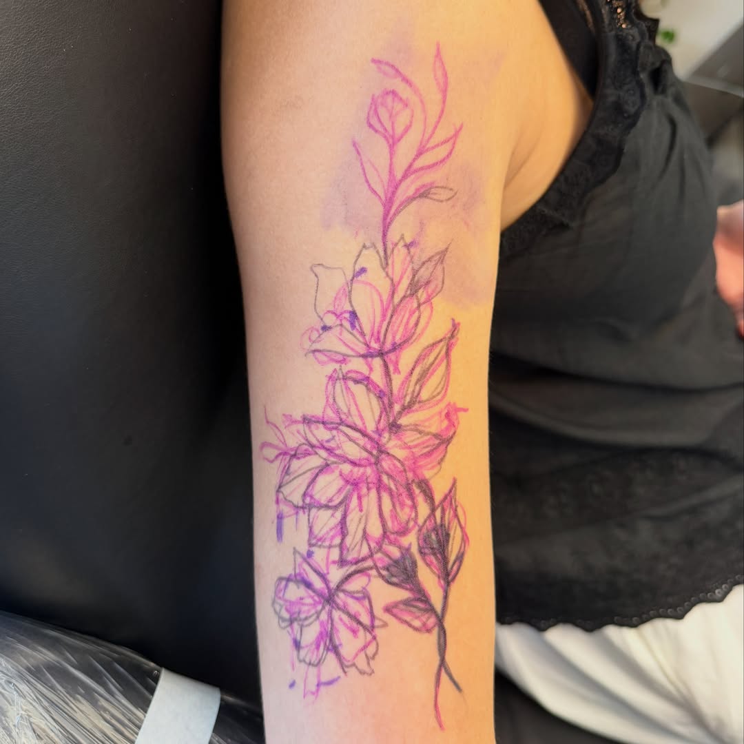 Floral arrangement watercolor tattoo on the forearm by Raul Najera Tattoo, Plano, Texas