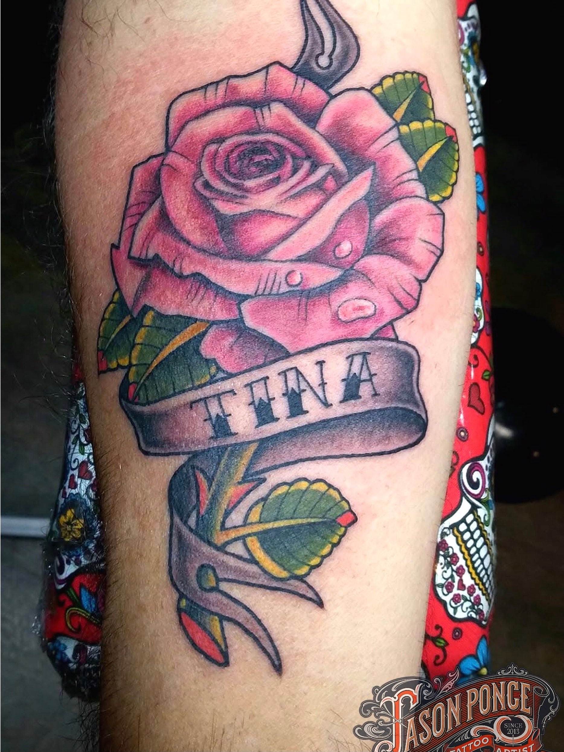 Rose with ribbon American traditional tattoo on the forearm by Jason Ponce