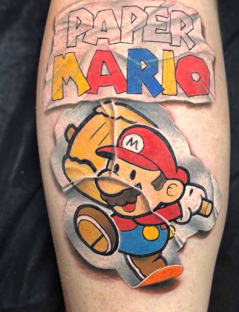 Paper Mario illustrative tattoo on the forearm by Tattoos by Fesik LLC