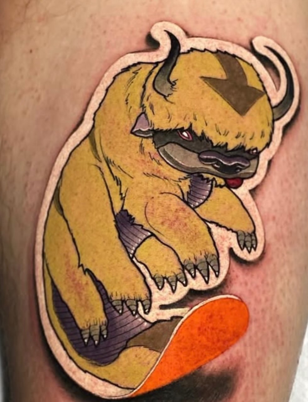 Beast American traditional tattoo on the thigh by Tattoos by Fesik LLC
