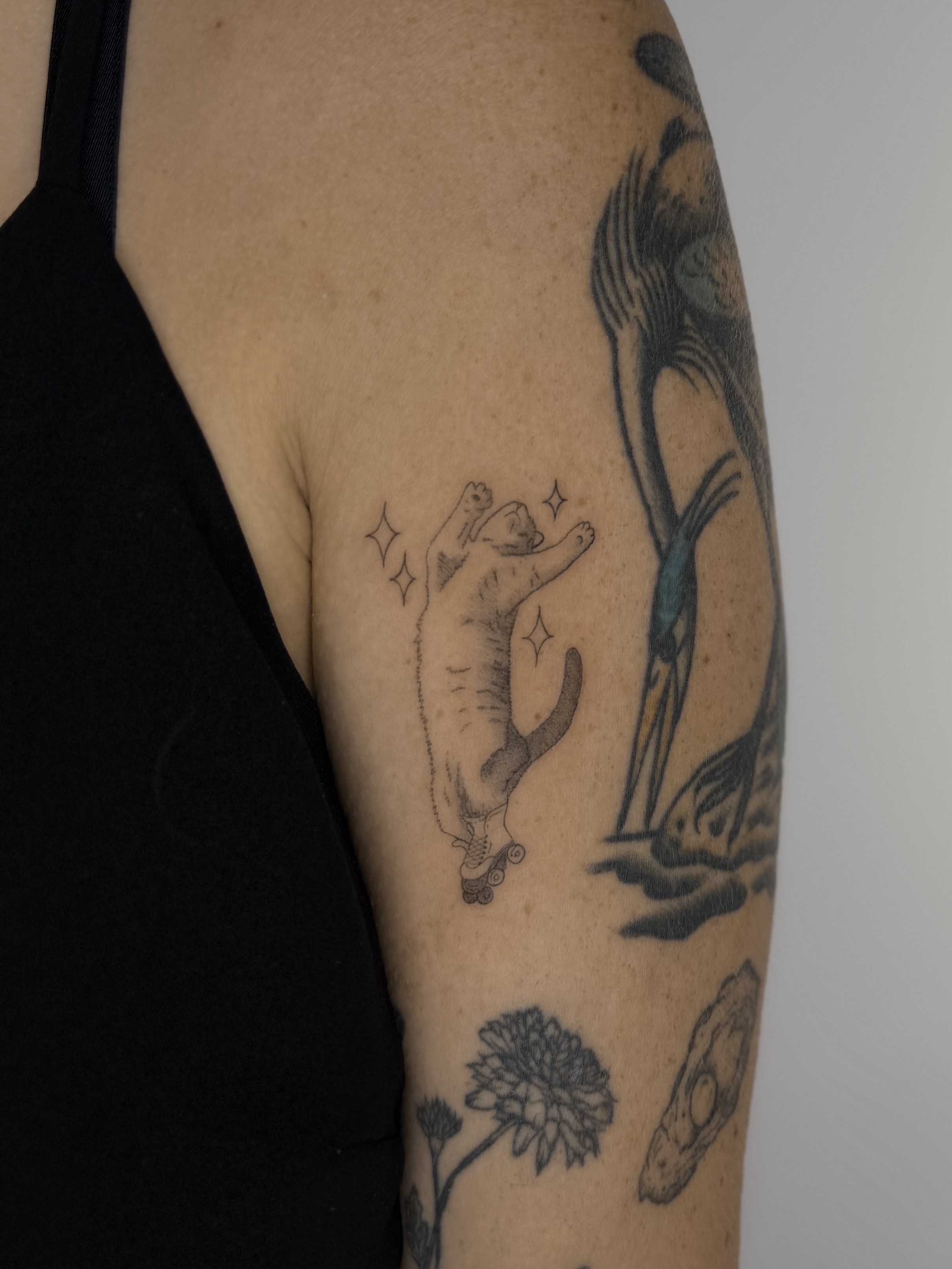 Polar bear black and grey tattoo on the upper arm by Fineline Tattoos DFW