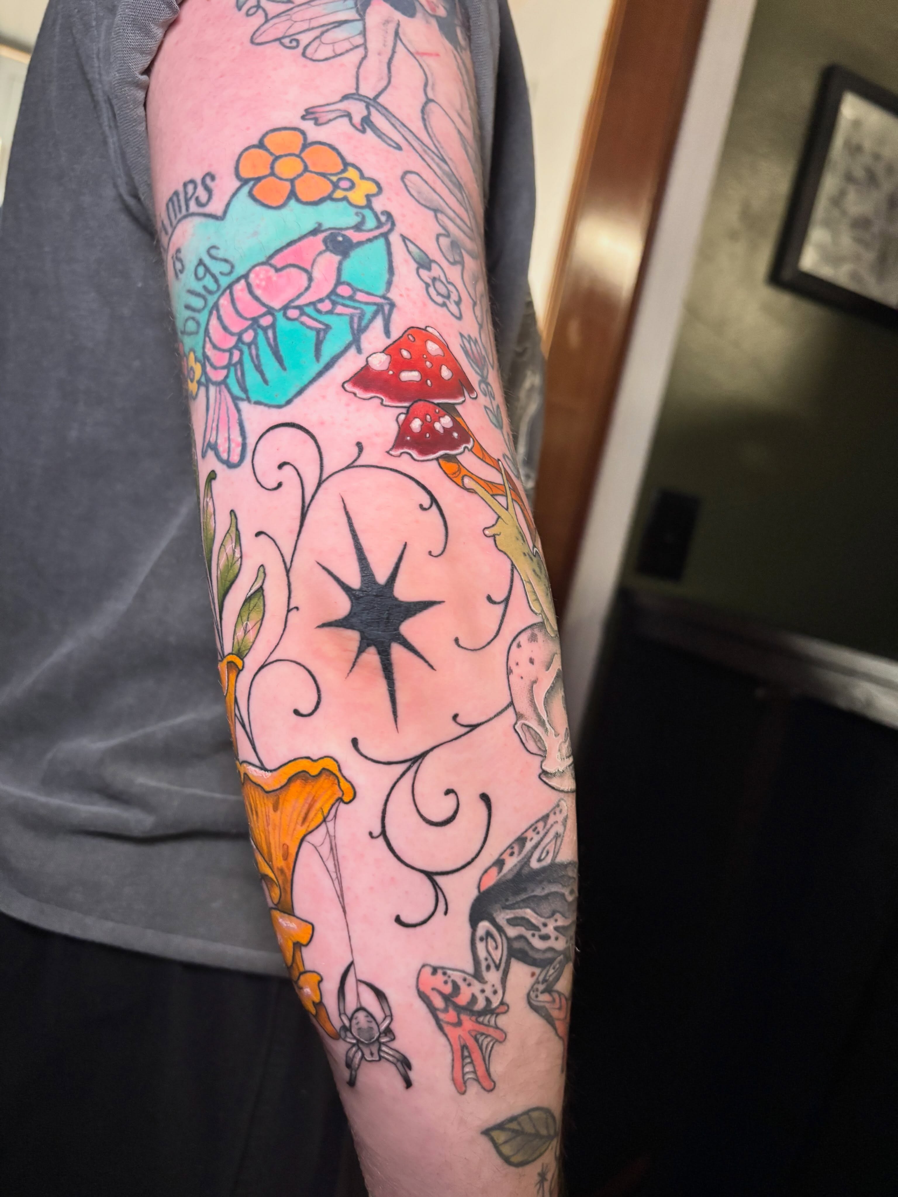 Fantasy creatures and mushrooms American traditional tattoo on the forearm by Wren Hollow, Portland, Oregon