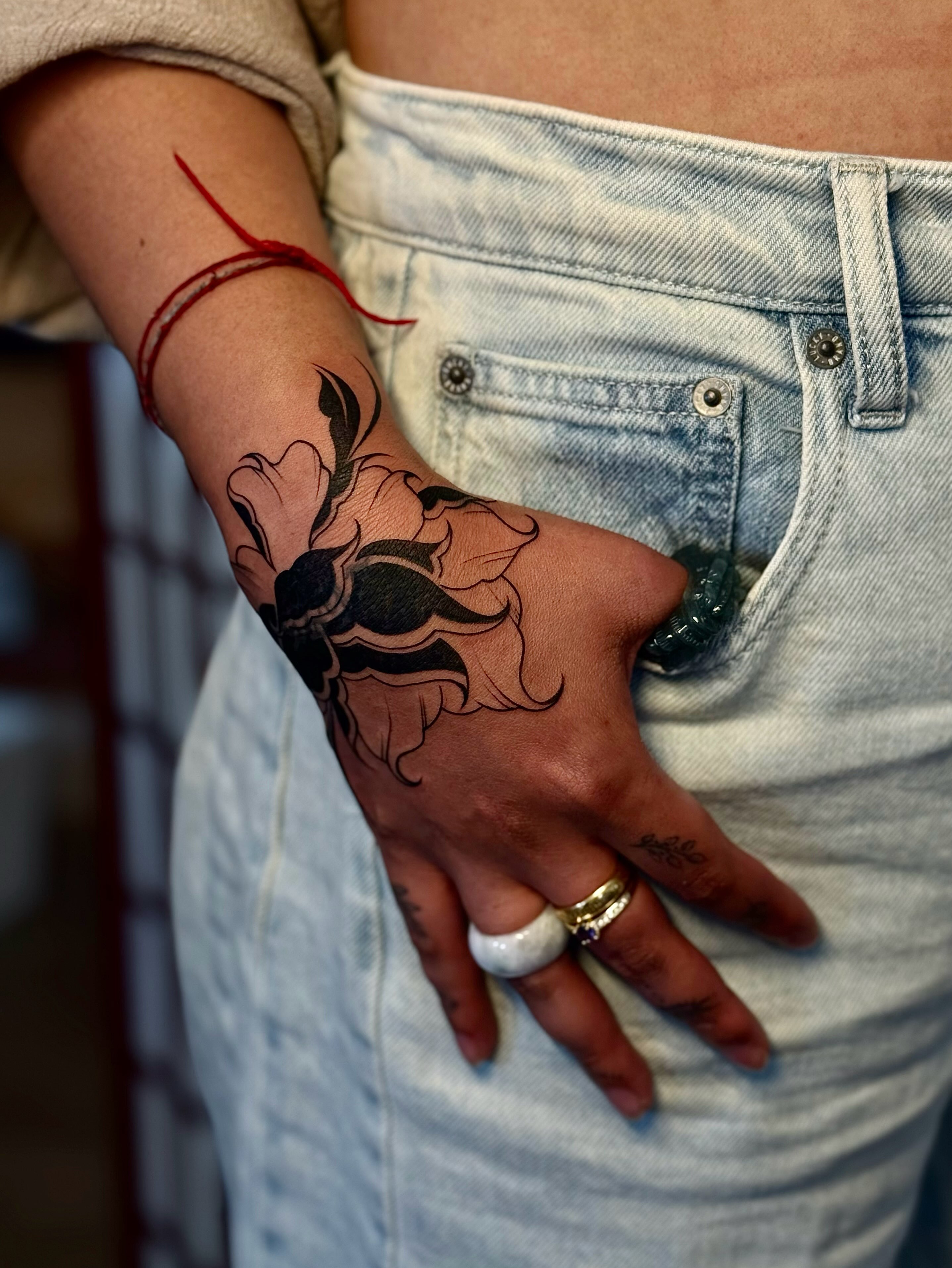 Flower black and grey tattoo on the hand by MISO ⟡ Bay Area Tattoo Artist