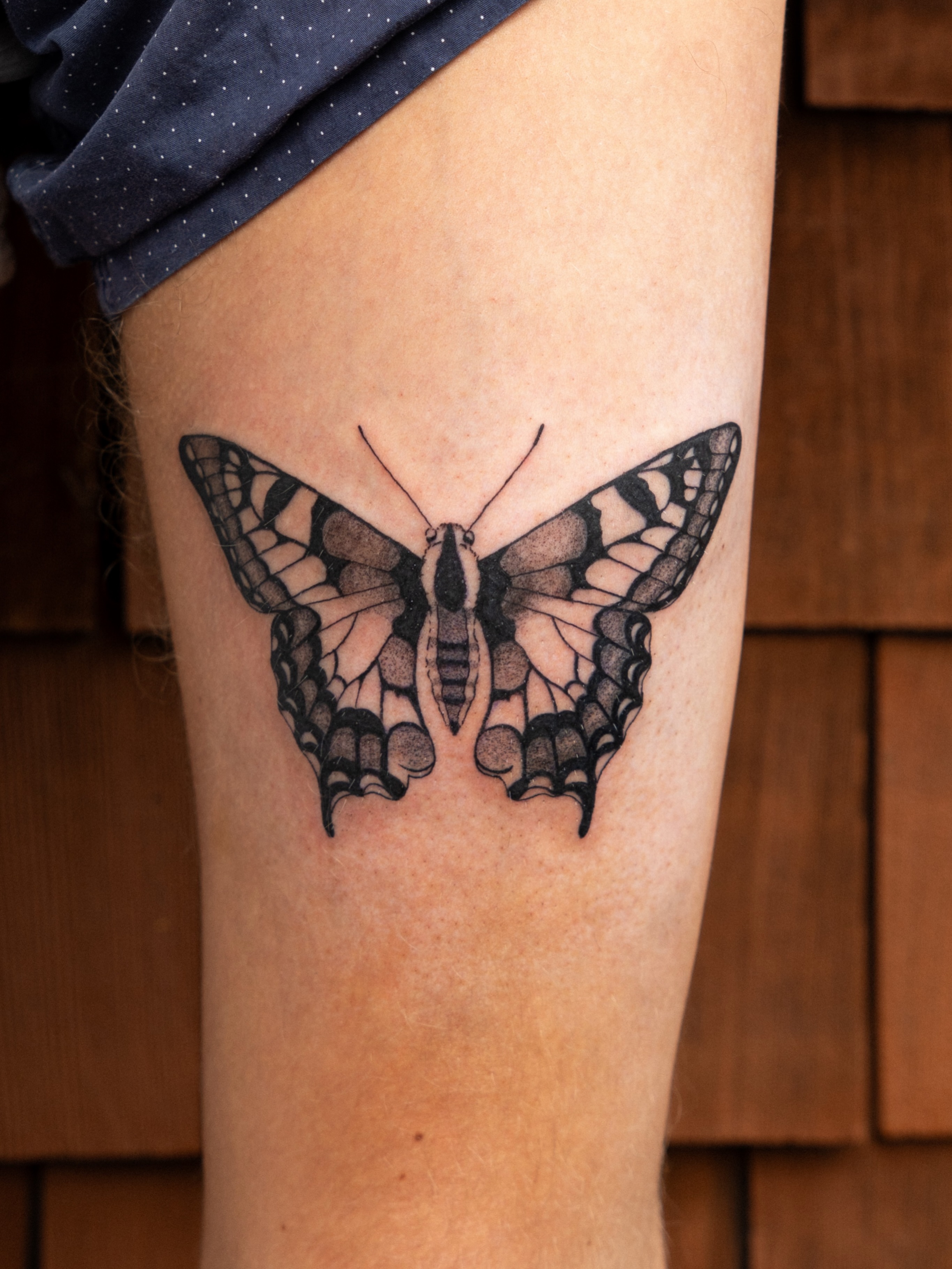 Butterfly black and grey tattoo on the thigh by Portland Tattoo Artist