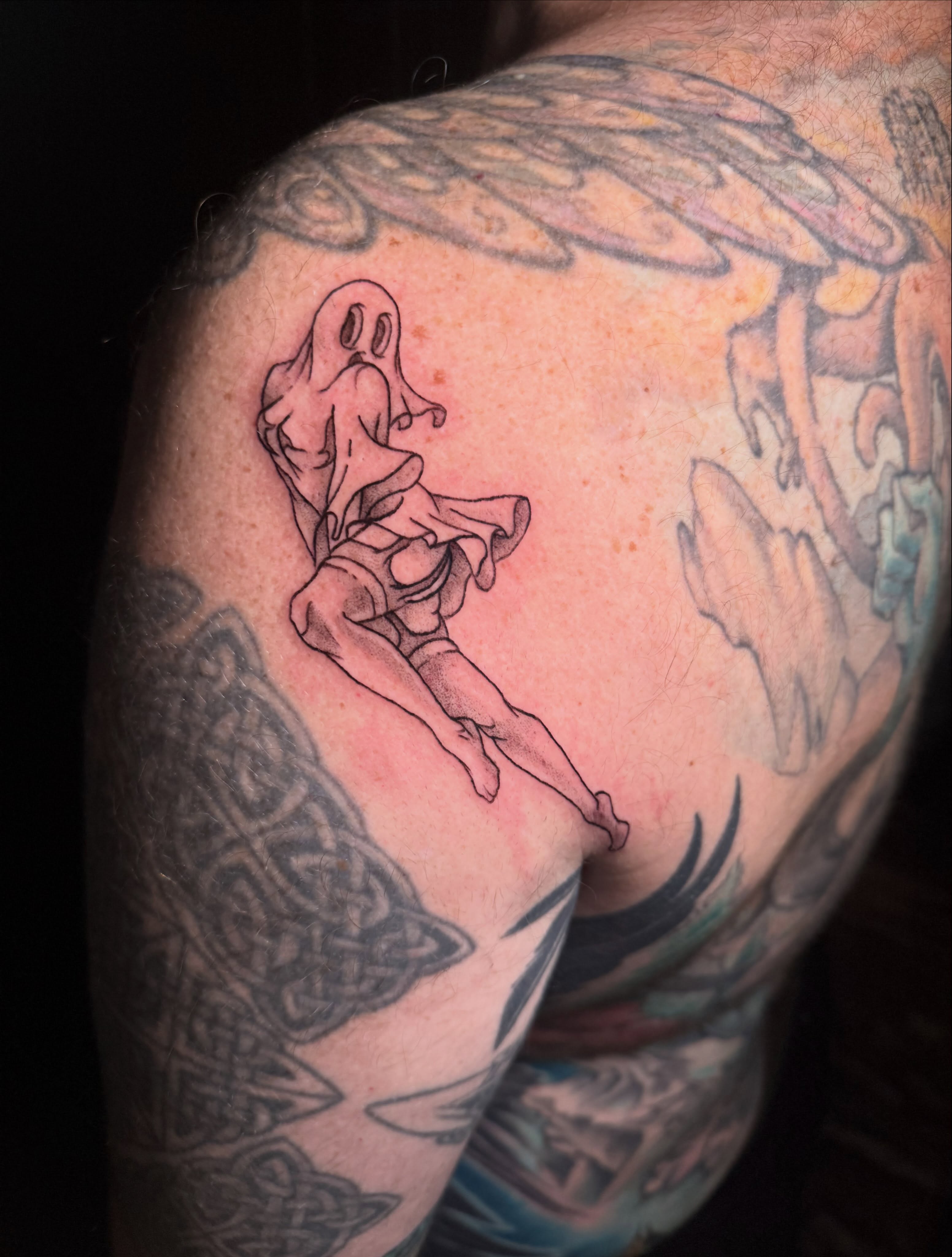 Ghostly figure fine line tattoo on the shoulder by Ivy-Jade Edwards, Memphis, Tennessee