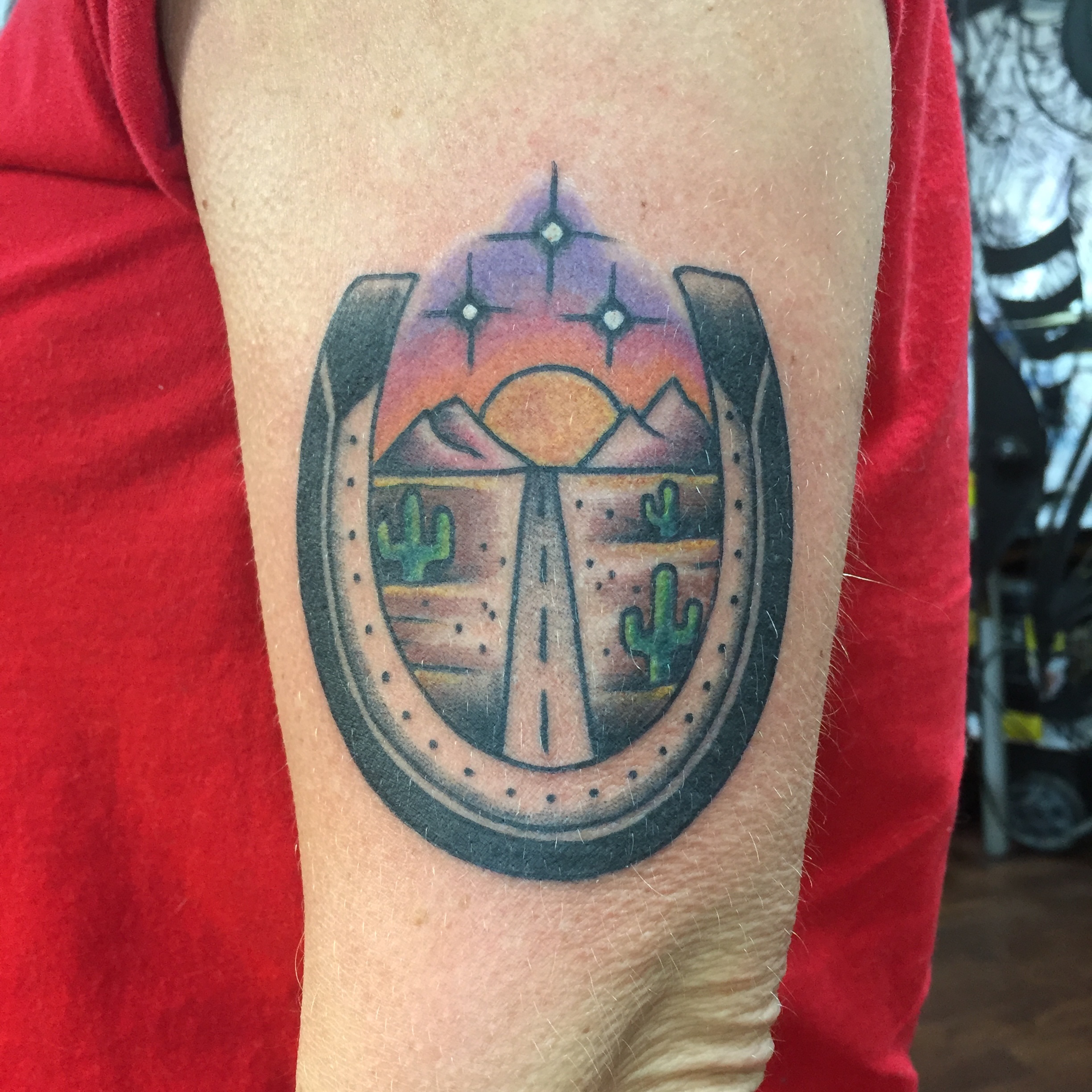 Desert landscape American traditional tattoo on the forearm by Ramsie Segura-Andrews