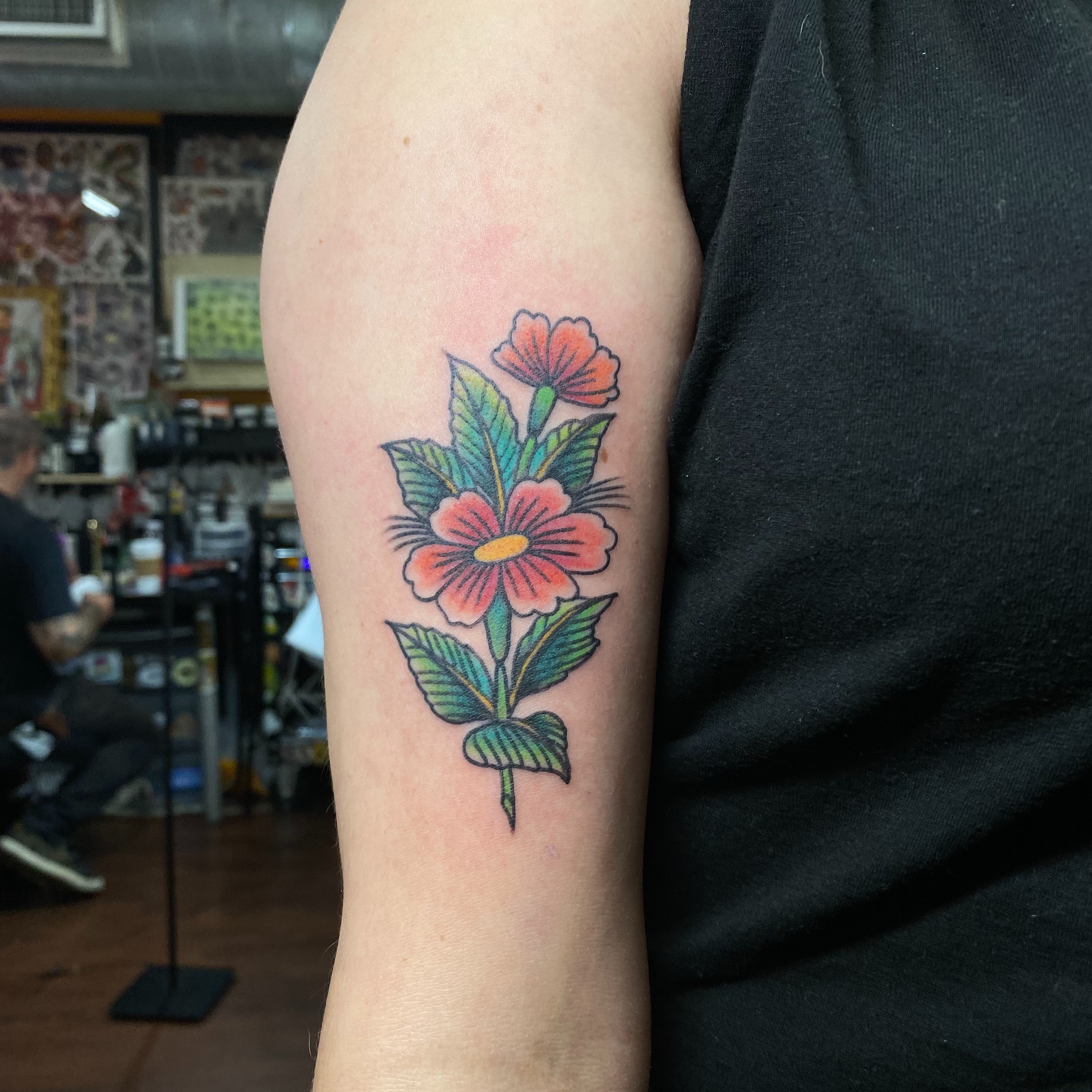 Floral arrangement American traditional tattoo on the forearm by Ramsie Segura-Andrews