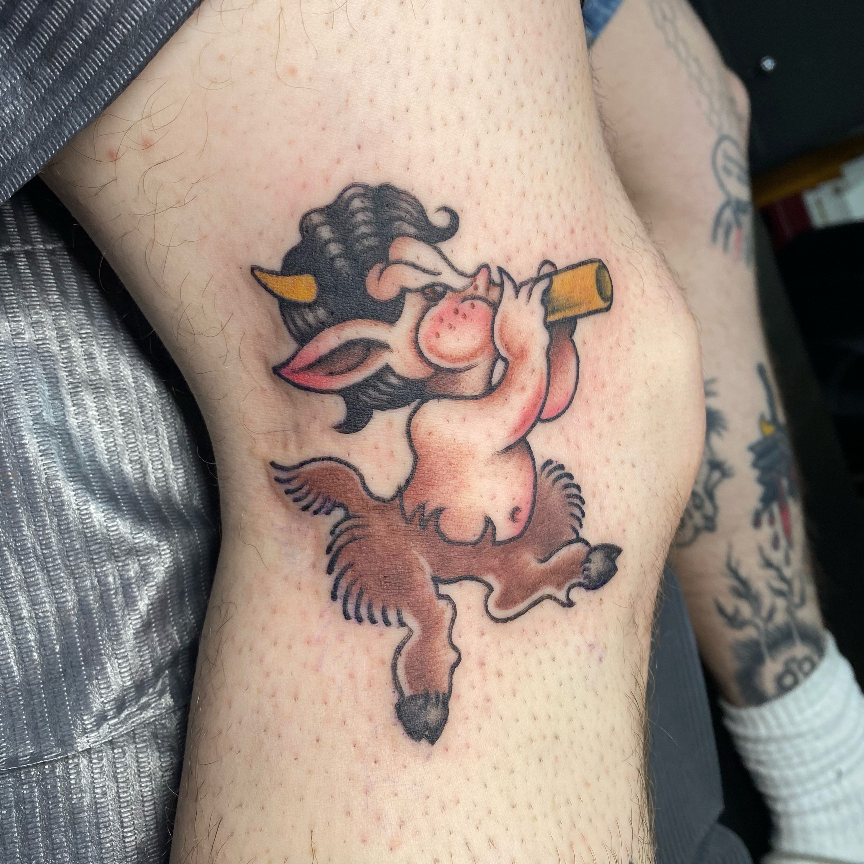 Piglet with corn cob American traditional tattoo on the forearm by Ramsie Segura-Andrews