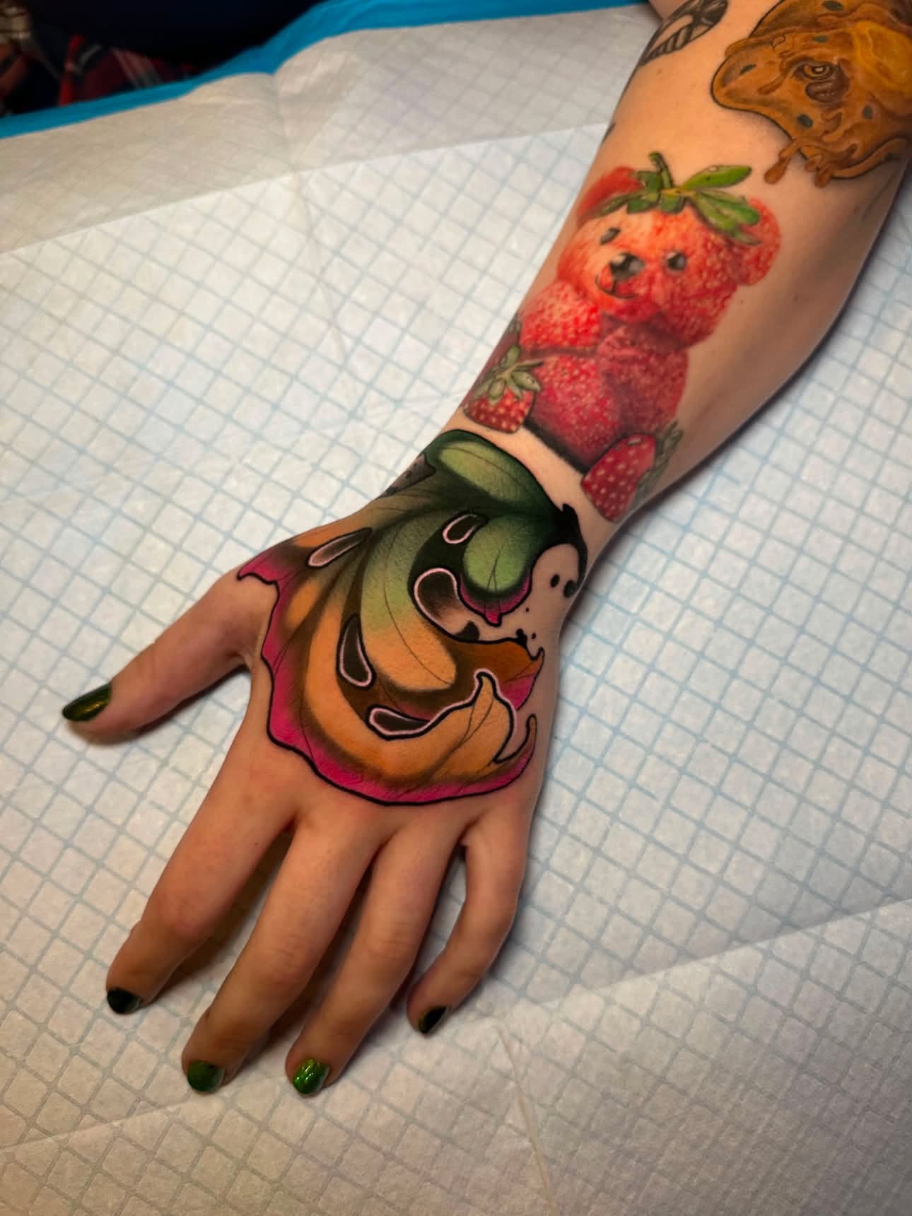 Strawberry bear American traditional tattoo on the hand by Abbie Kaitlynn Taylor, Dayton, Ohio