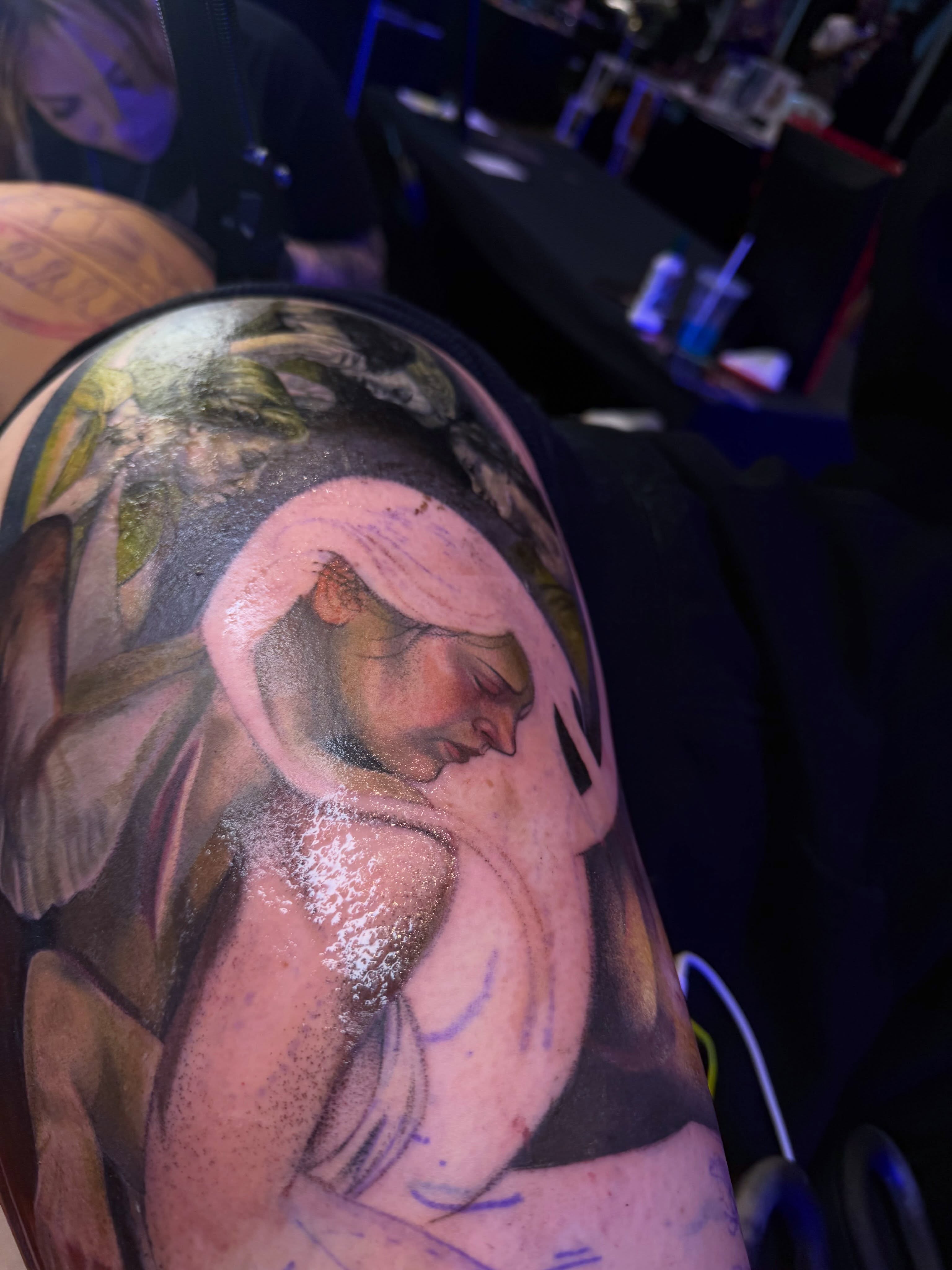 Religious figure realism tattoo on the upper arm by Austin Jones