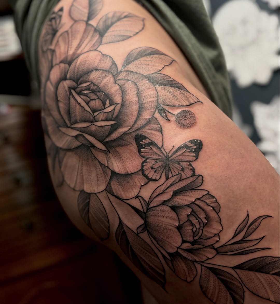Flowers and butterfly realism tattoo on the forearm by Kyle Ketzler