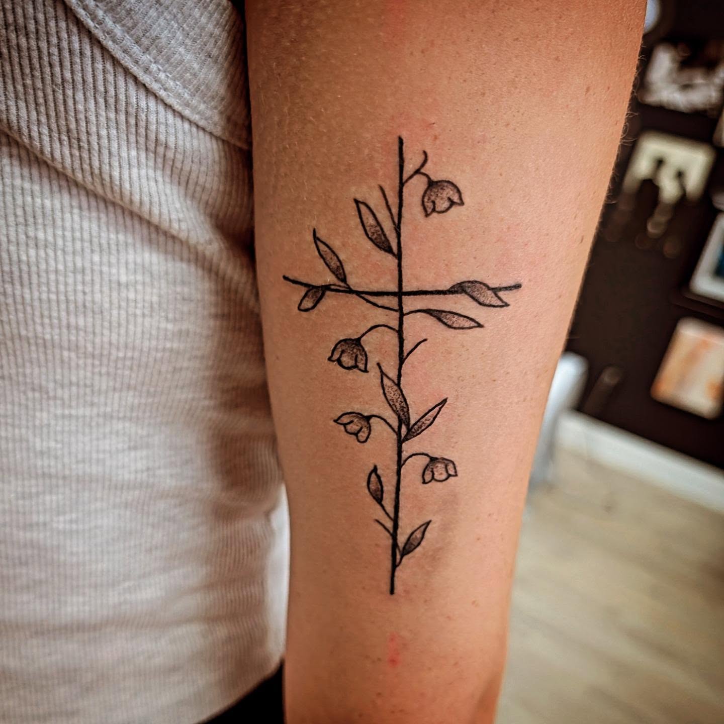 Lily of the valley fine line tattoo on the forearm by Matt Mahl