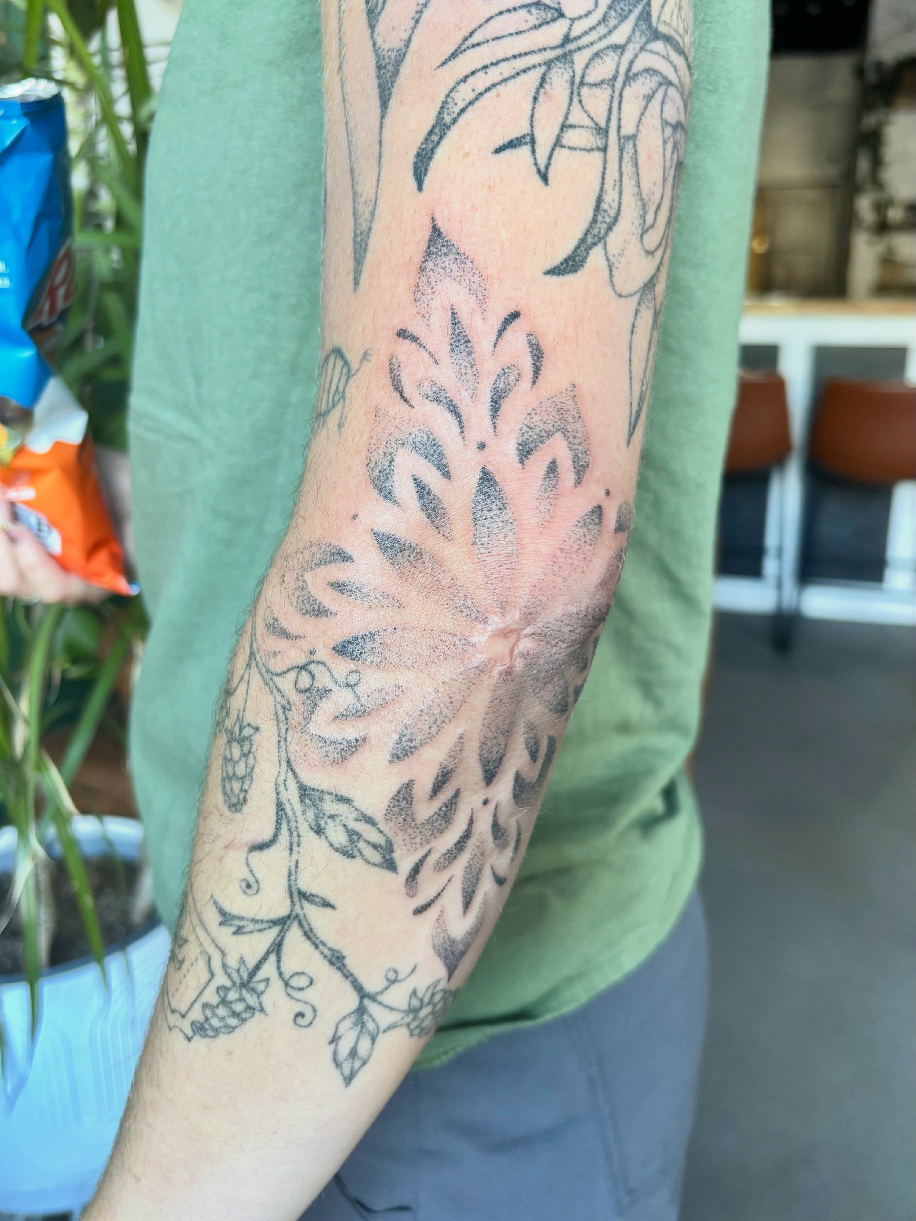 Floral vine dotwork tattoo on the forearm by Ashley, Elk Horn, Iowa