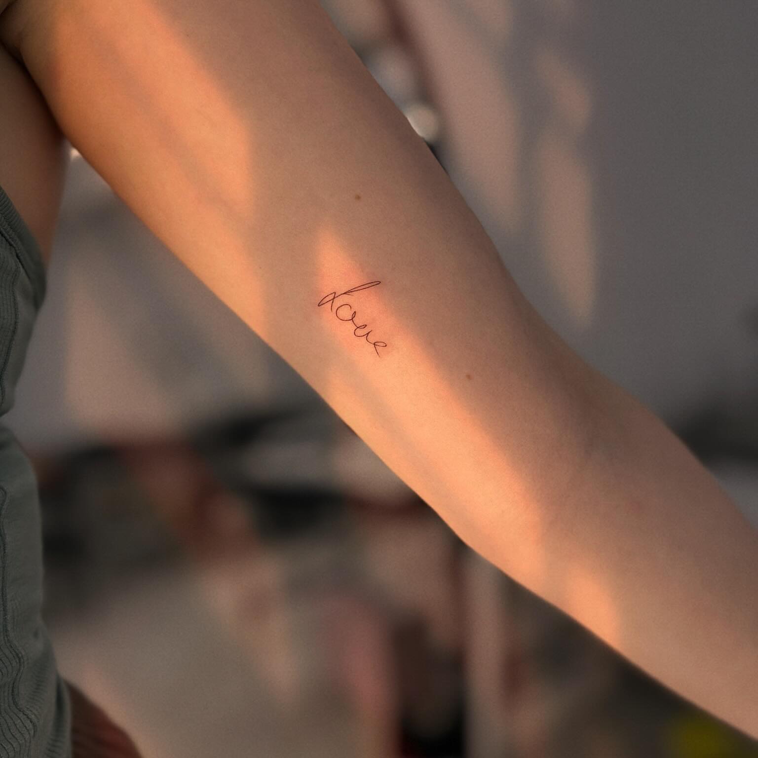 Focus lettering script tattoo on the forearm by Ellie