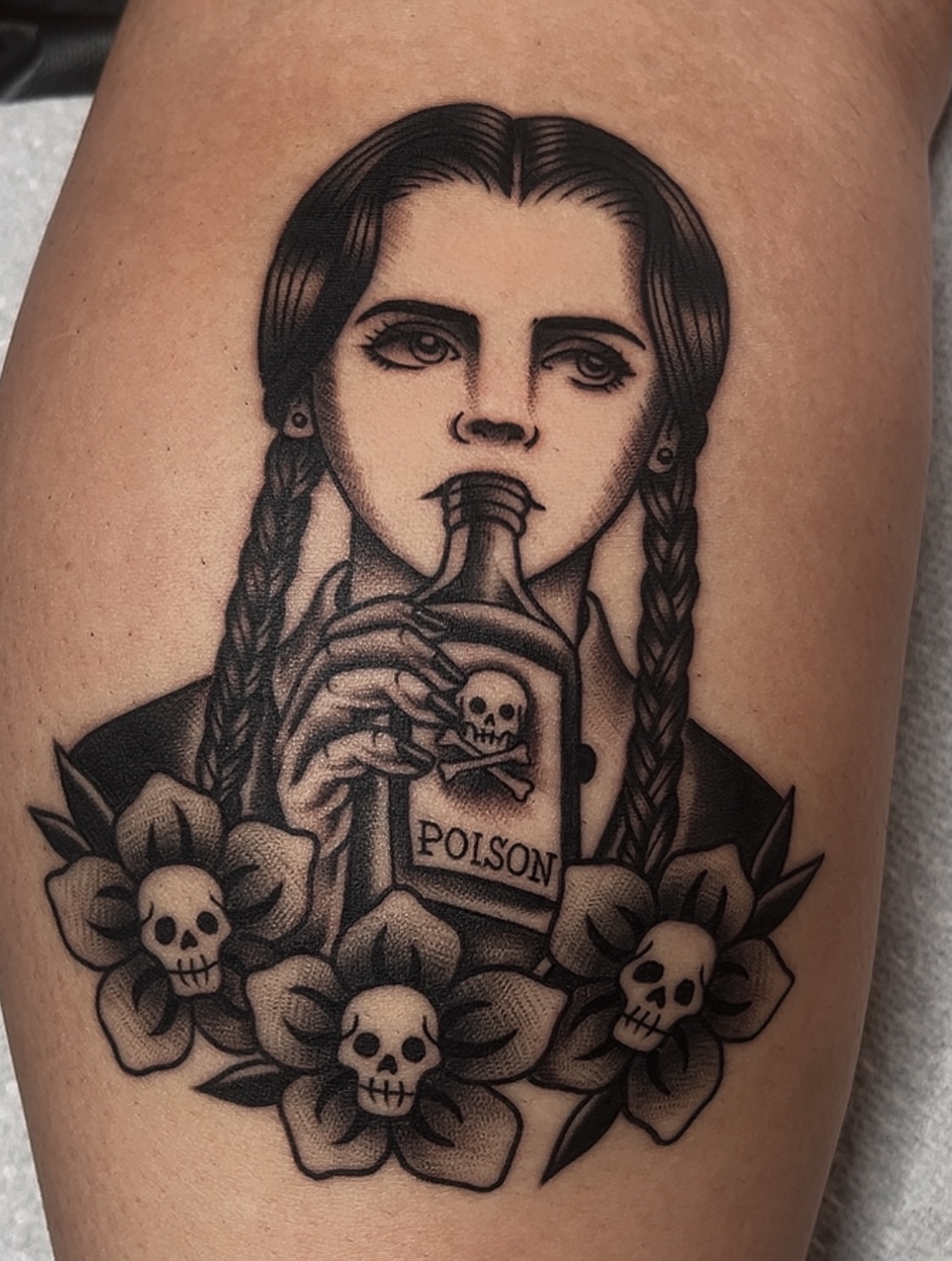 Woman drinking poison American traditional tattoo on the thigh by Las Vegas Tattoo Artist