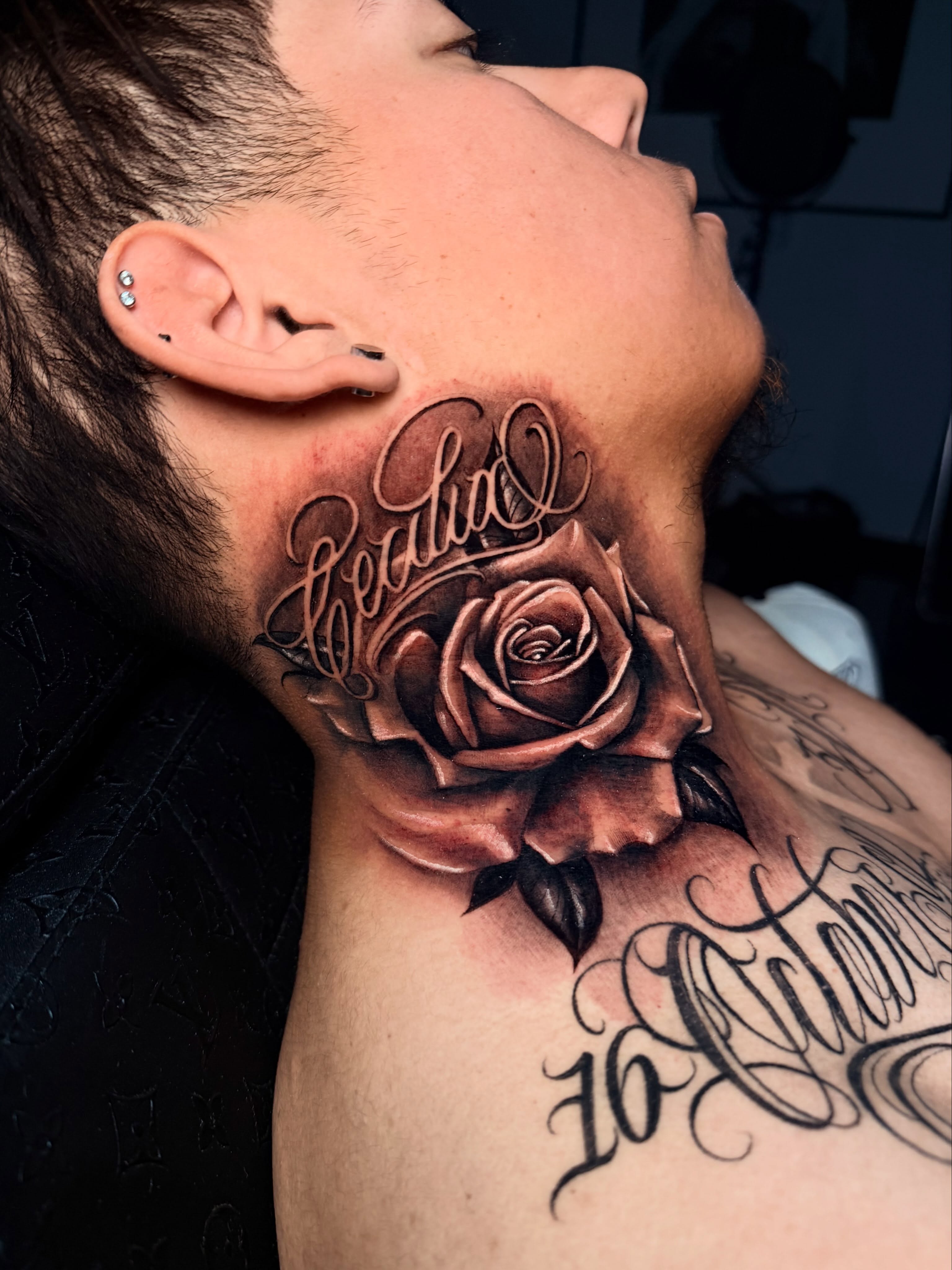 Rose and script realism tattoo on the neck by Lettering