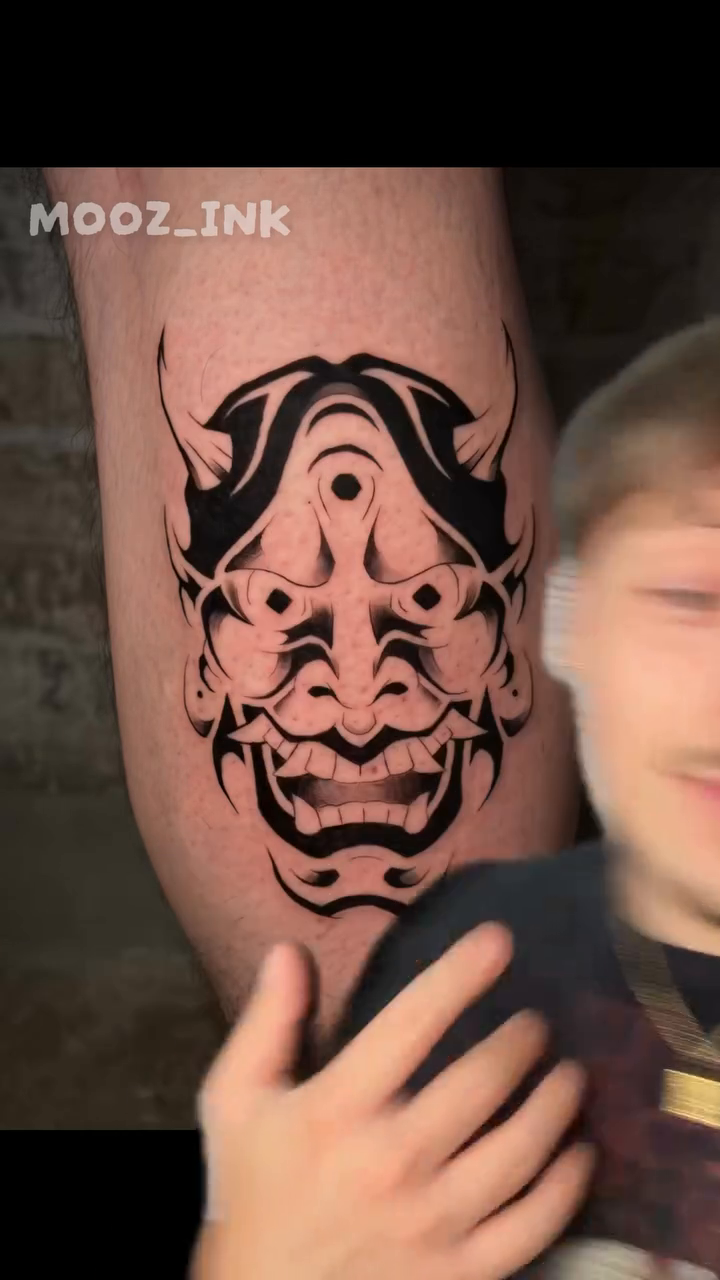 Japanese demon mask blackwork tattoo by Musa Selman