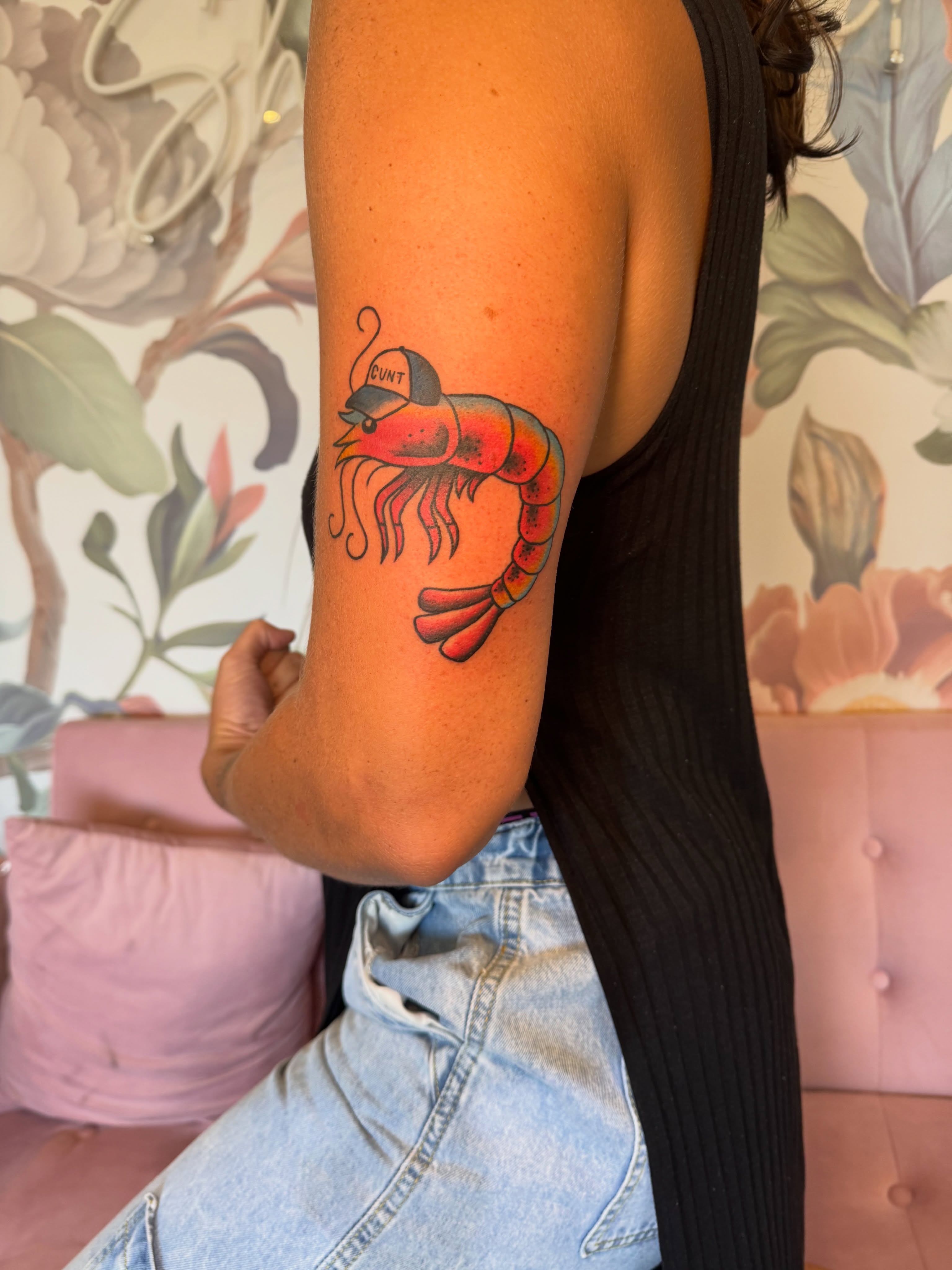 Lobster wearing a cap American traditional tattoo on the forearm by Kinzi Brown