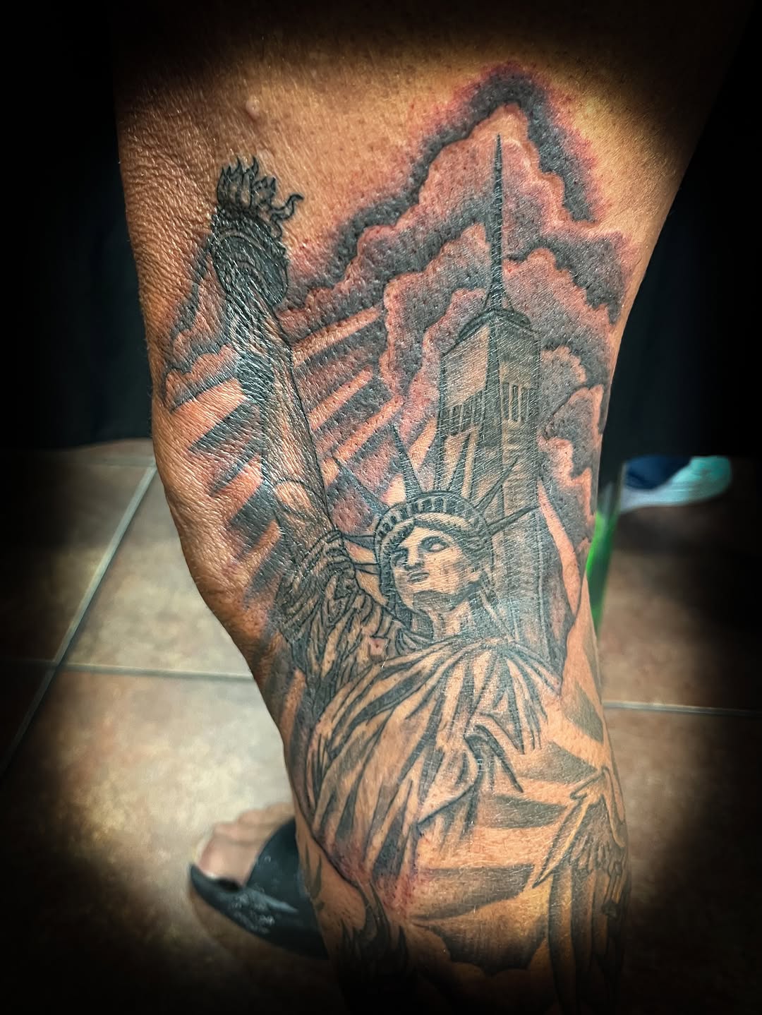 Statue of liberty and world trade center tattoo on the leg by Melissa Peña NYC
