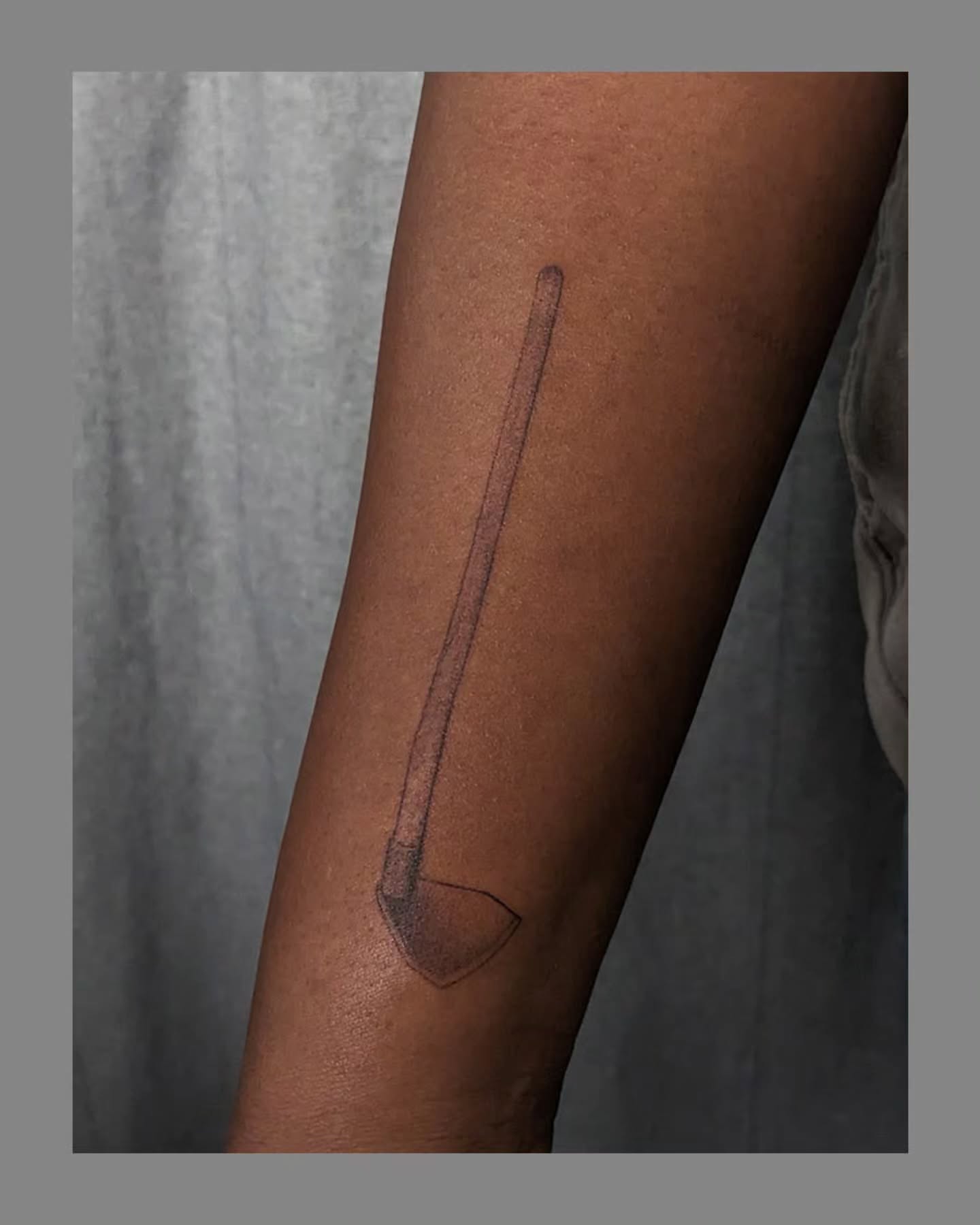 Sword black and grey tattoo on the forearm by Marria