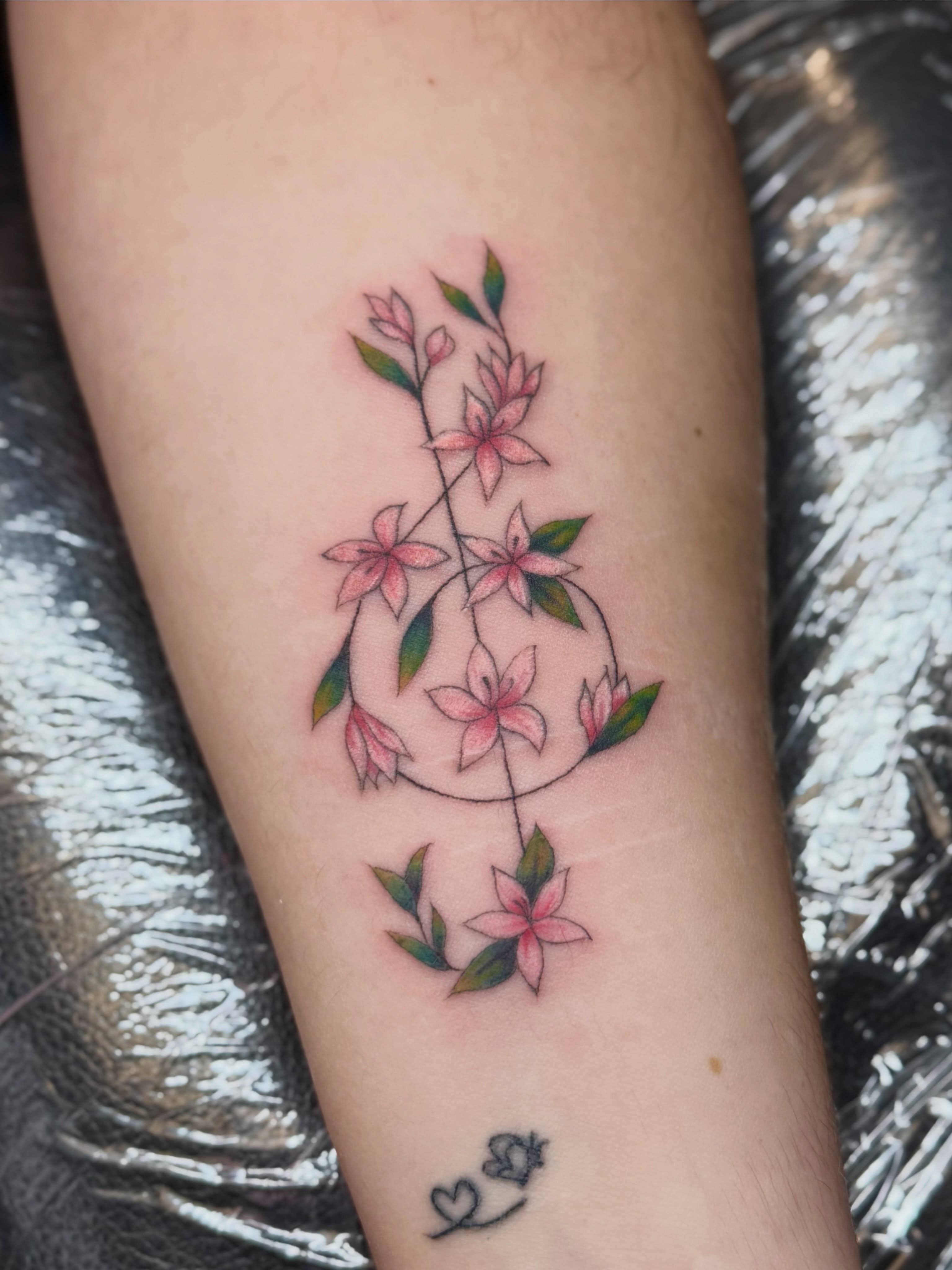 Floral arrangement new school tattoo on the forearm by Bri ⚡️✨