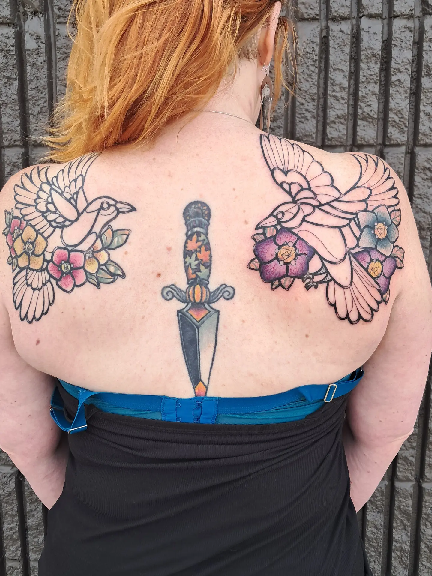 Bird and dagger American traditional tattoo on the back by Erika Hollingsworth