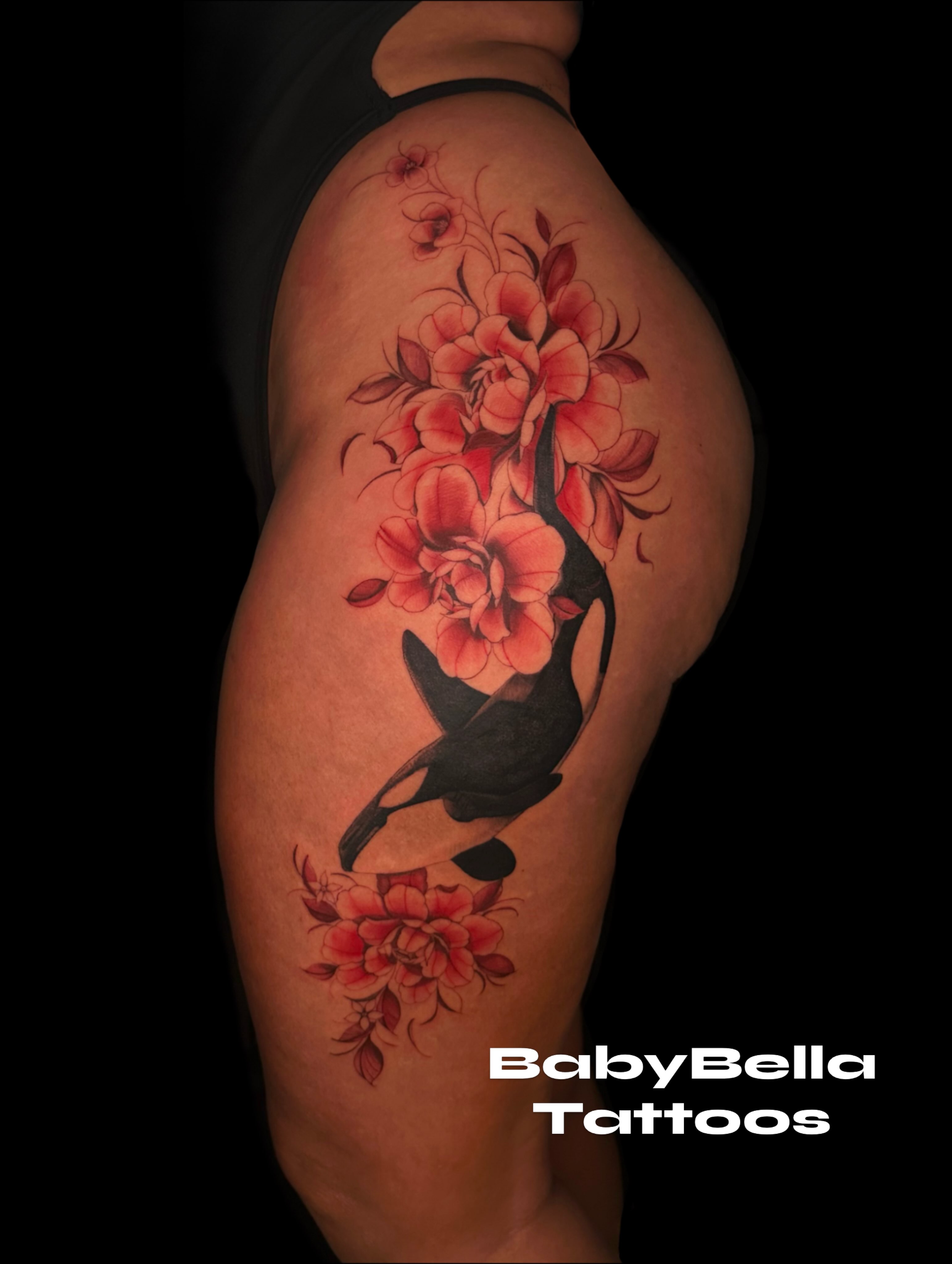 Whale and flowers realism tattoo on the thigh by Elizabeth Stepp
