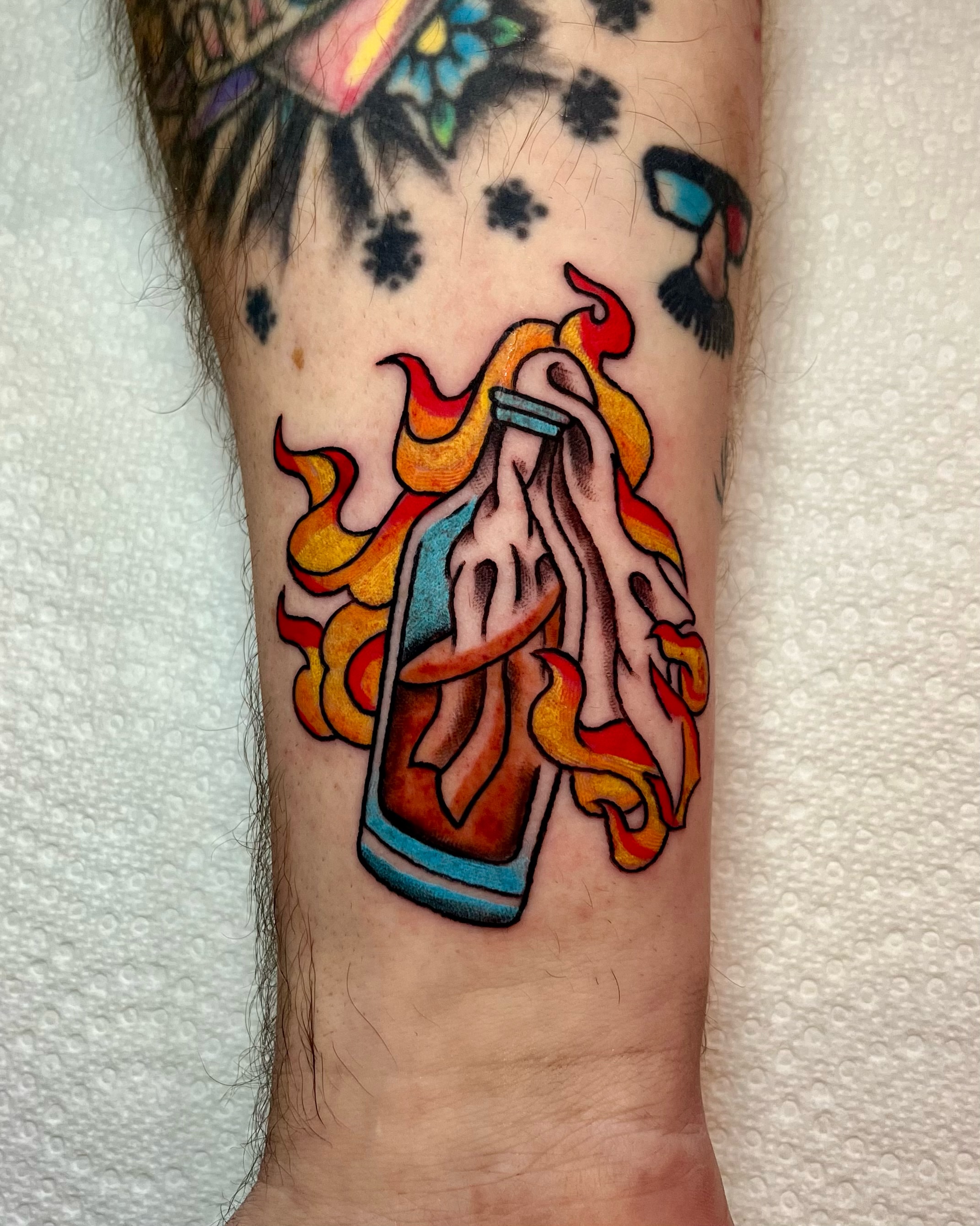 Hot sauce bottle American traditional tattoo on the forearm by EO, Chicago, Illinois