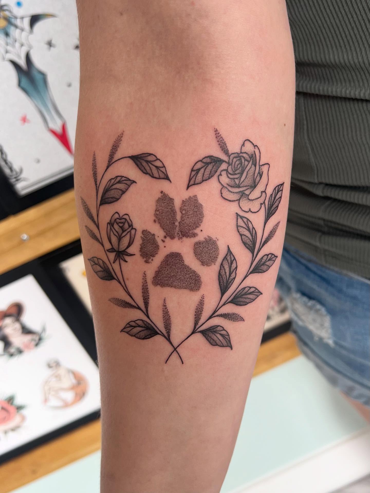 Paw print with floral wreath dotwork tattoo on the forearm by 𝖆𝖑𝖞𝖘𝖘𝖆 ☽