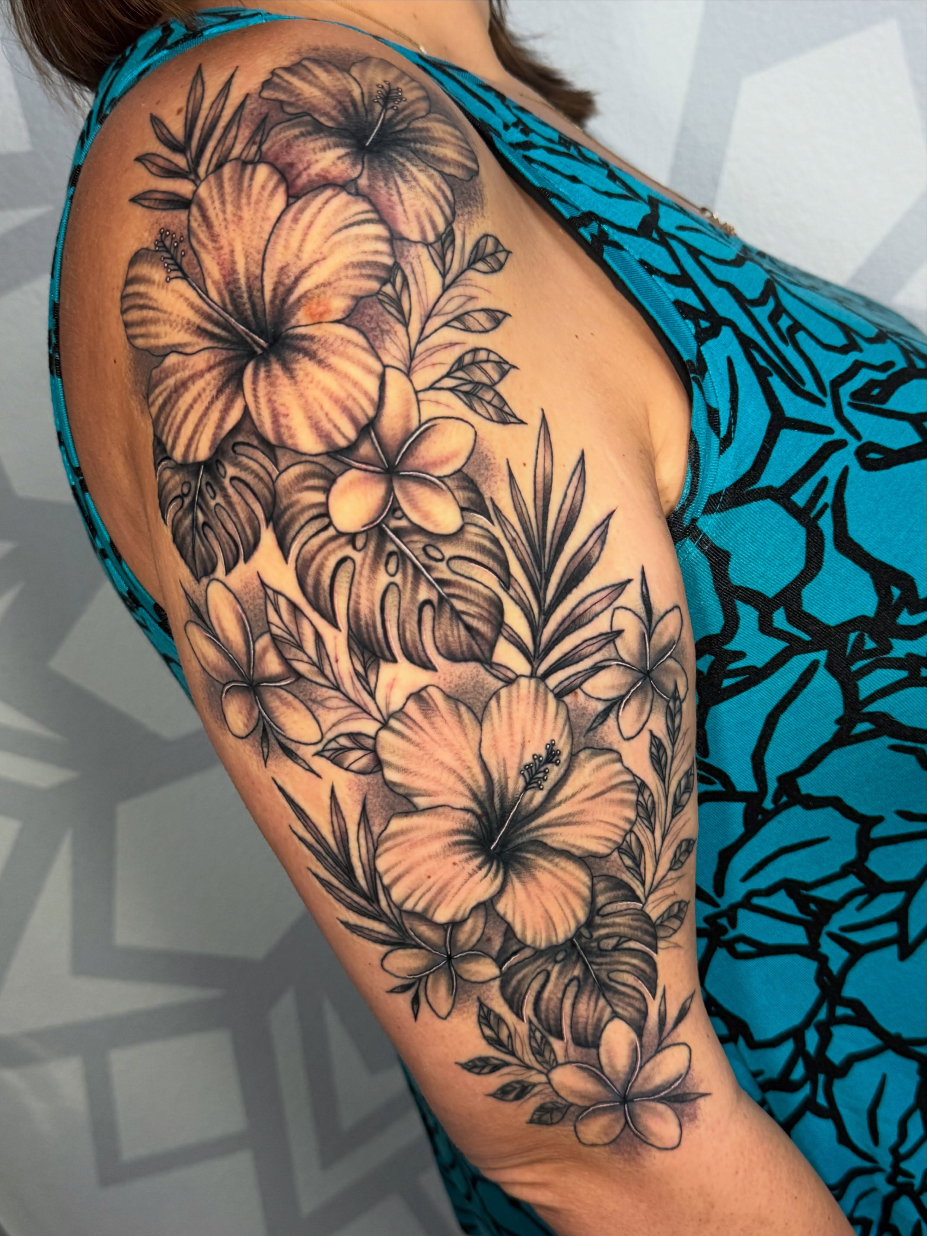 Hawaiian flowers realism tattoo on the shoulder by Las Vegas Tattoo Artist, Las Vegas, Nevada