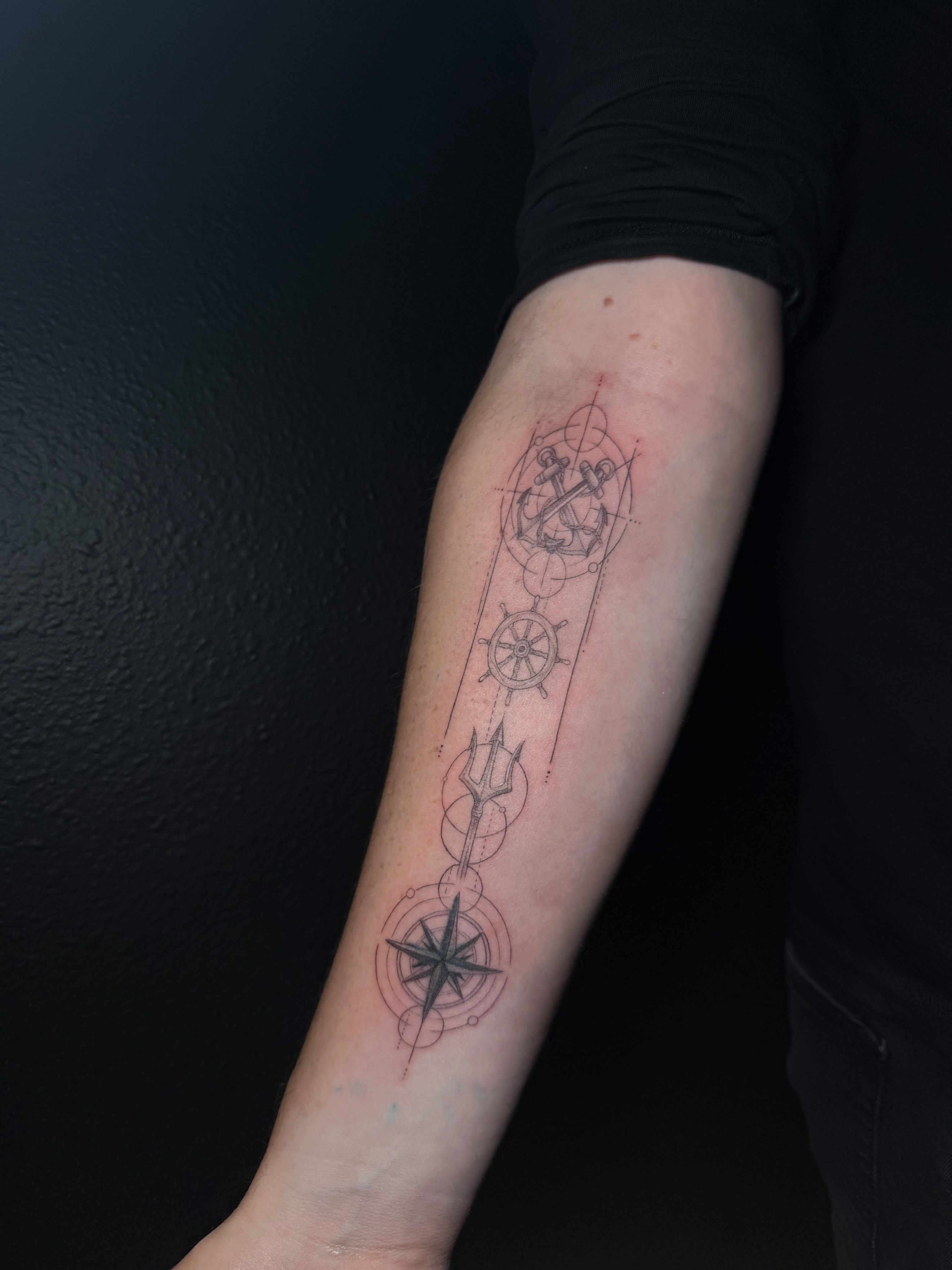 Nautical symbols geometric tattoo on the forearm by Ink Darling, Carlisle, Iowa